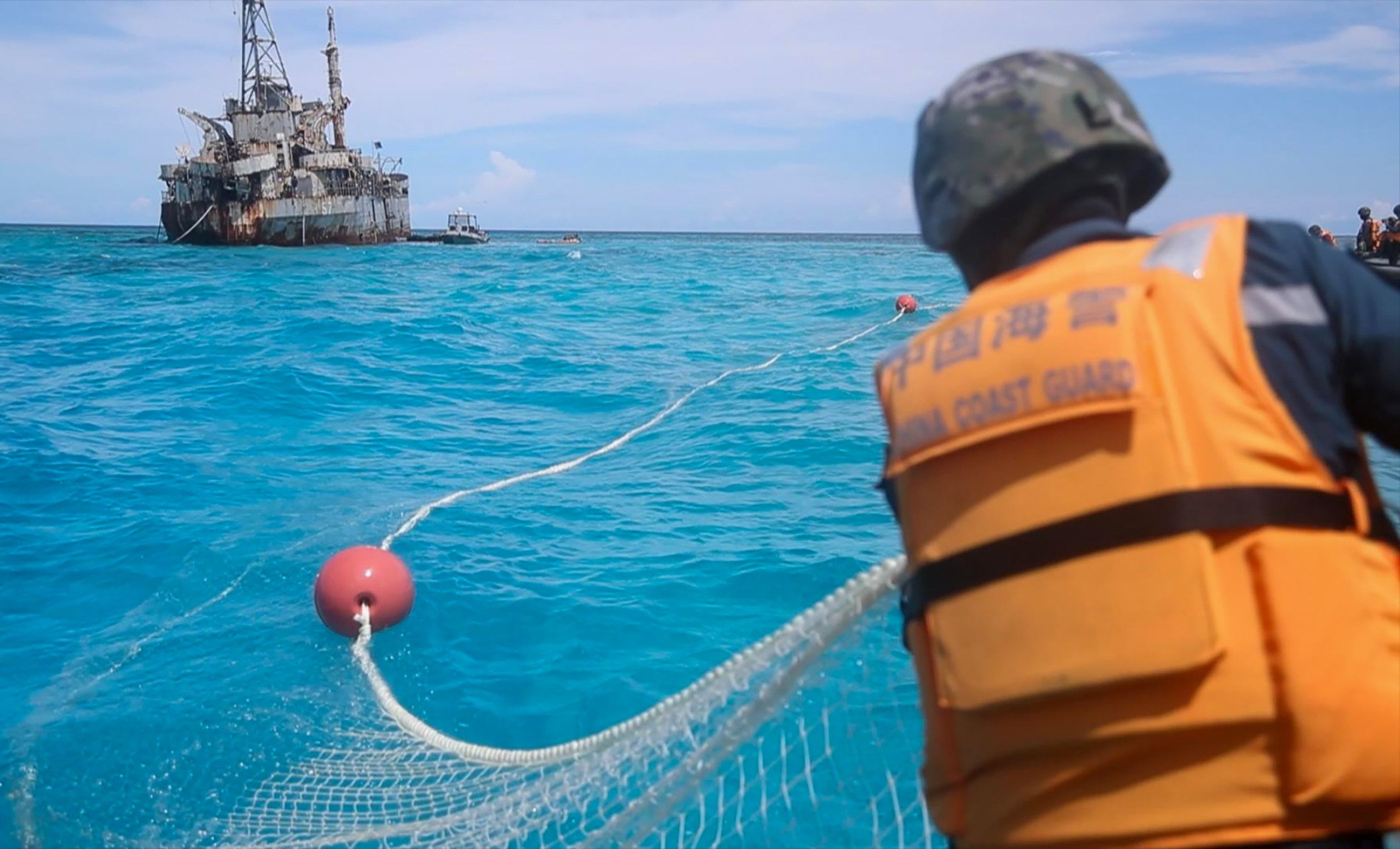 The Chinese coastguard recovers Philippine fishing nets near a disputed area of the South China Sea. Photo: Xinhua