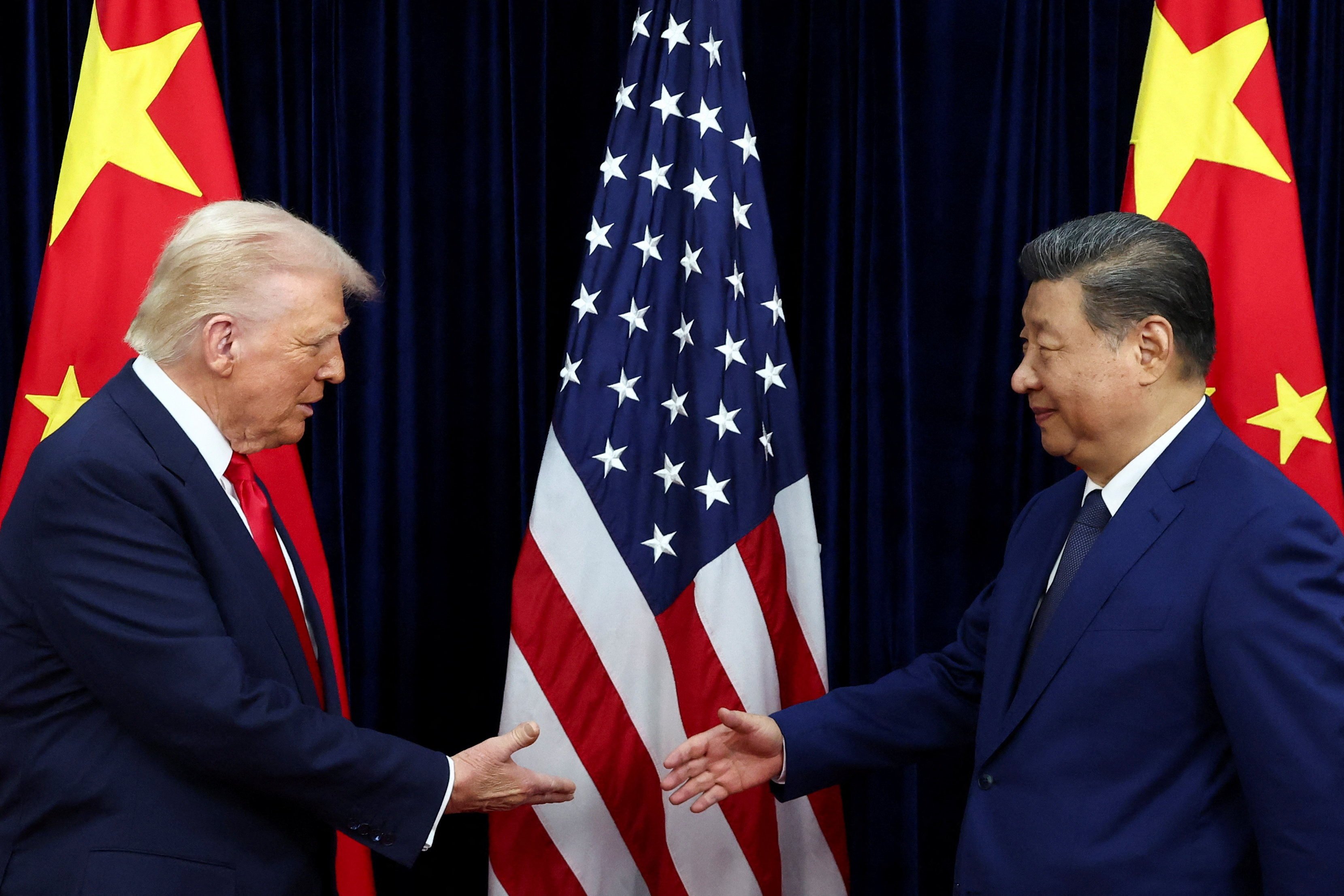US President Donald Trump and President Xi Jinping shake hands at an October meeting in South Korea. The two are expected to meet again in four weeks. Photo: Reuters