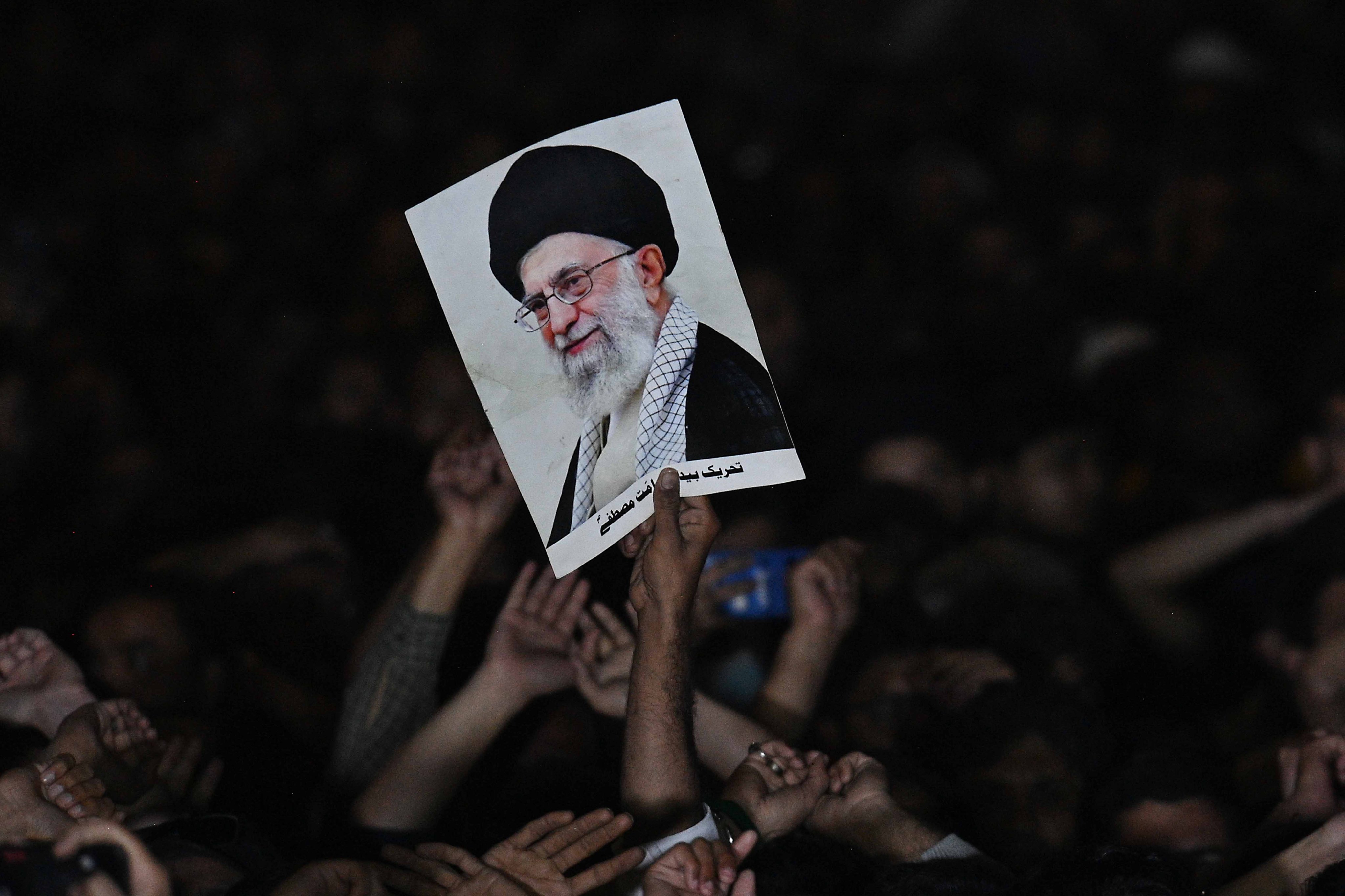 People attend the funeral of protesters killed outside the US consulate in Karachi, Pakistan, on Sunday. Photo: EPA