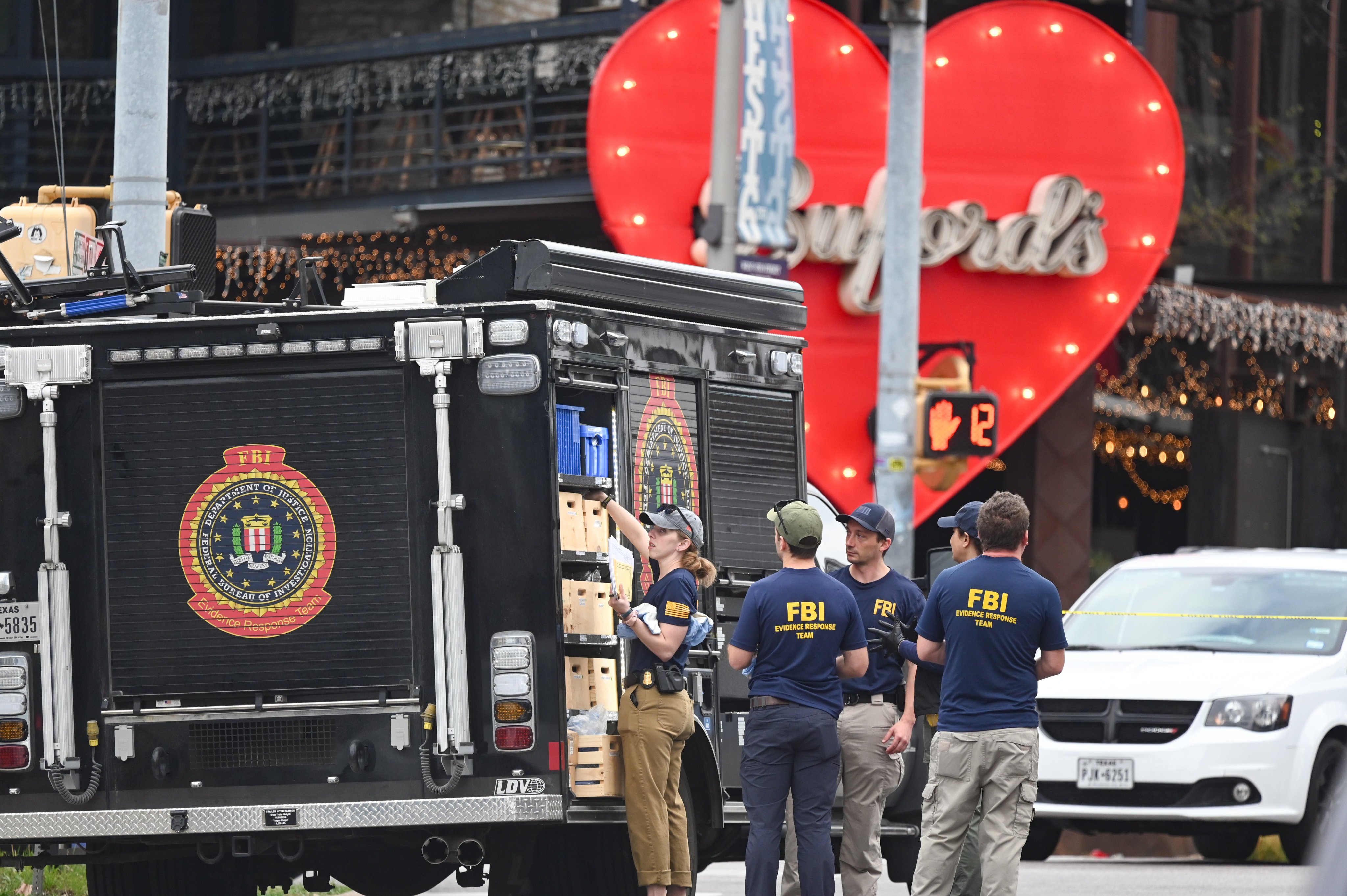 The Austin Police Department and the FBI investigate a shooting at Buford’s in Austin, Texas on Sunday. Photo: AP