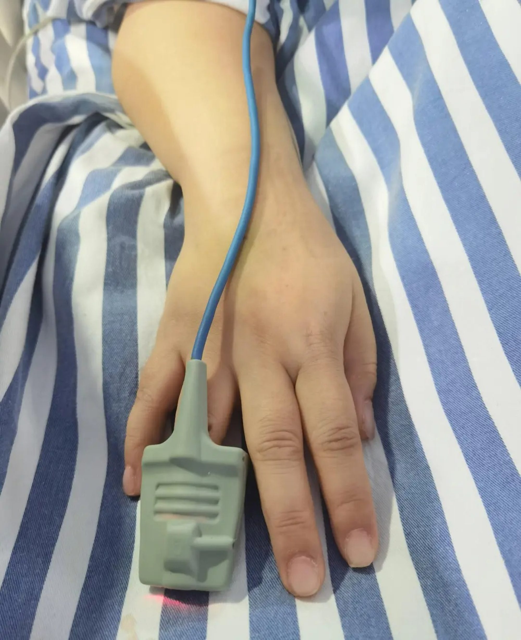 After the manicurist removed the fake nails, above, medical staff could proceed. Photo: Handout