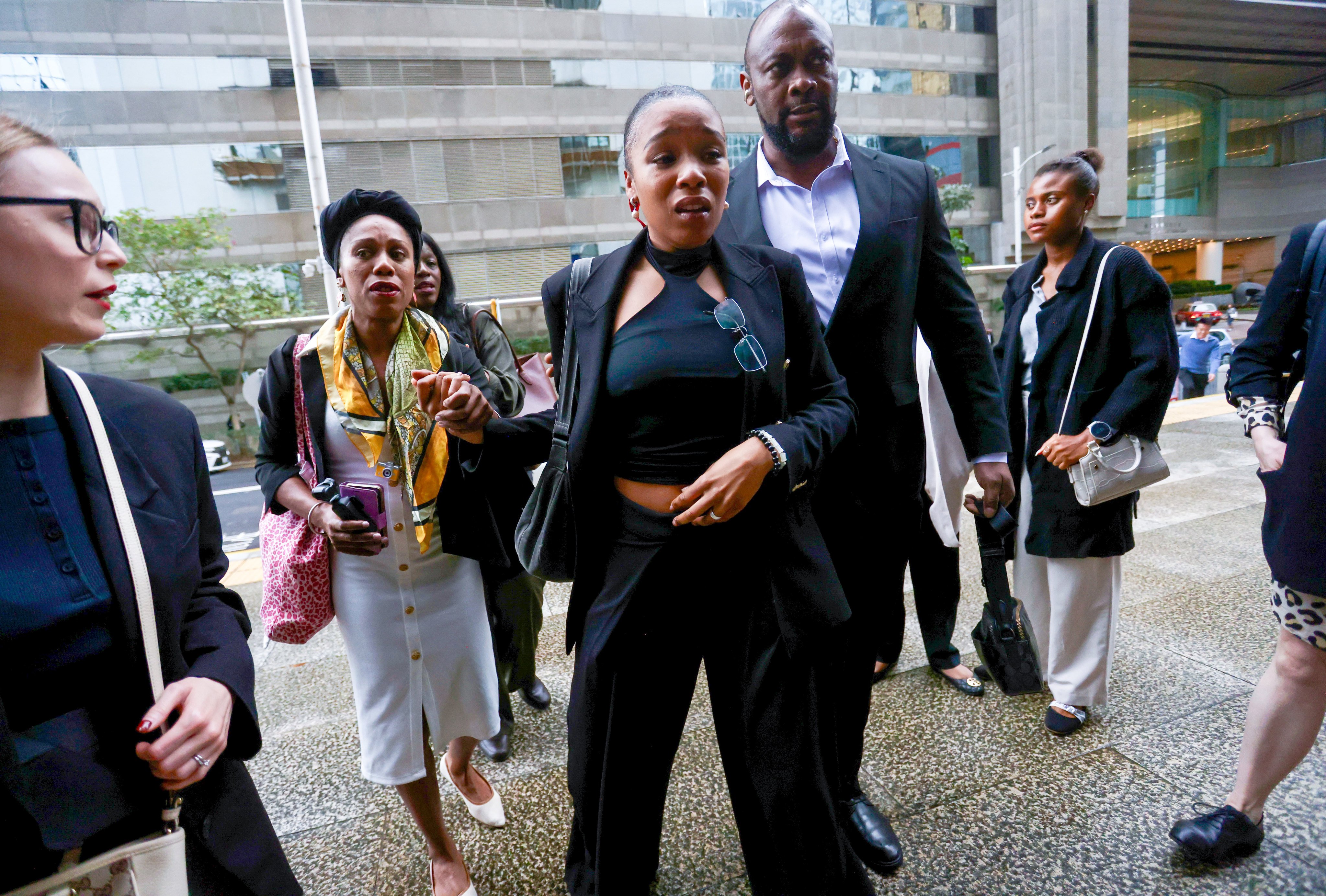 Defendant Isabel Anonia Barbra Eudora Rose, centre, outside District Court in Wan Chai. Photo: Jonathan Wong