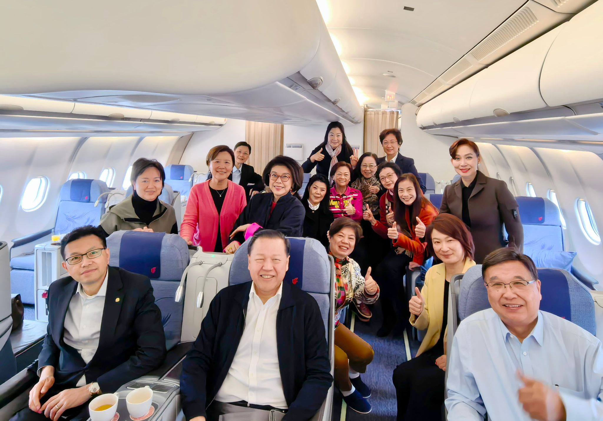Starry Lee (yellow jacket) and other Hong Kong delegates on their way to Beijing for the annual “two sessions”. Photo: Handout