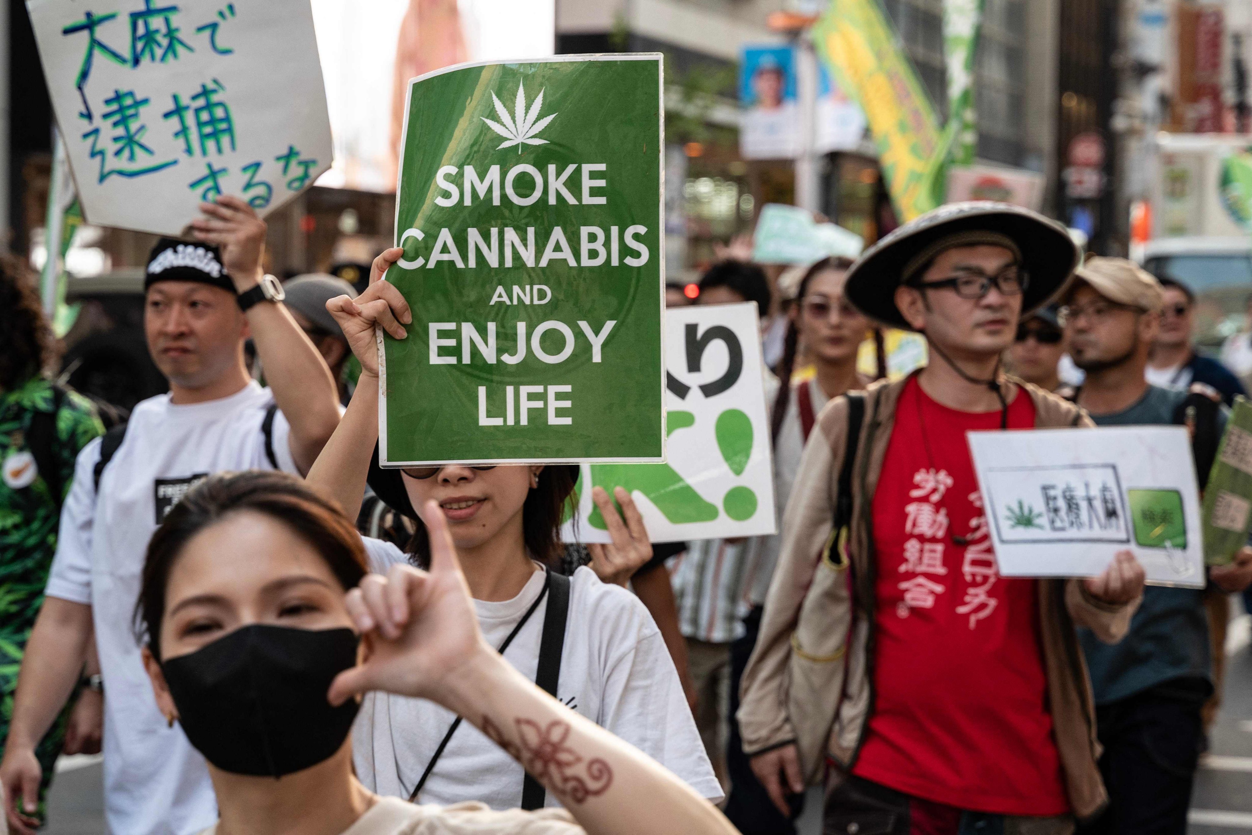 People take part in a march in Tokyo in 2023 calling for the legalisation of cannabis. Photo: AFP