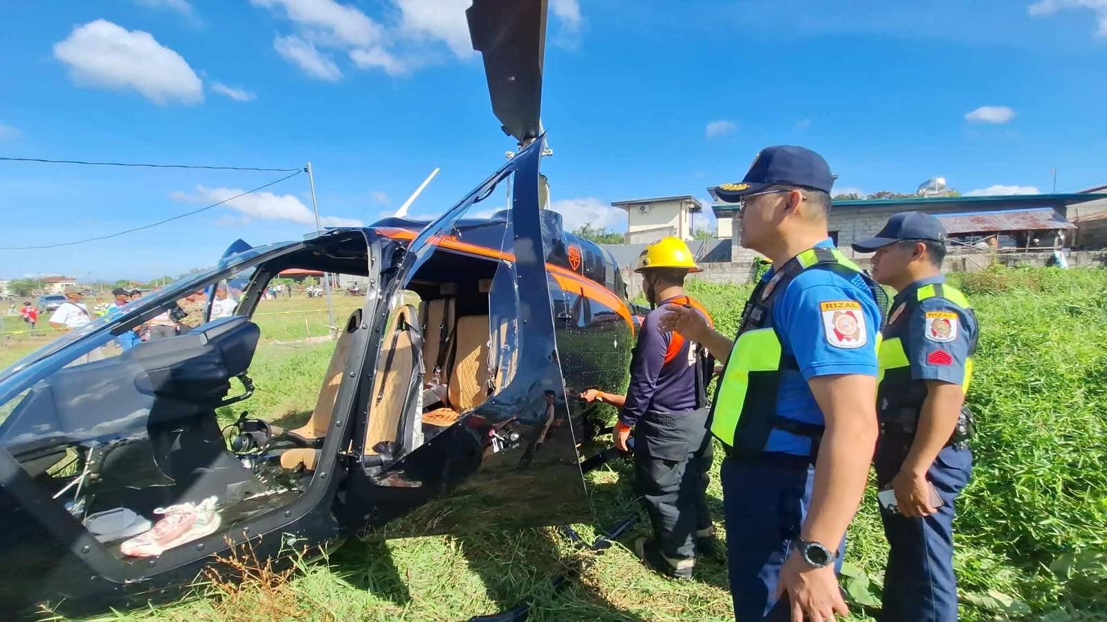 Police officers inspect the wreckage of a helicopter that crashed in Rizal on Tuesday. Photo: Rizal Provincial Police Office
