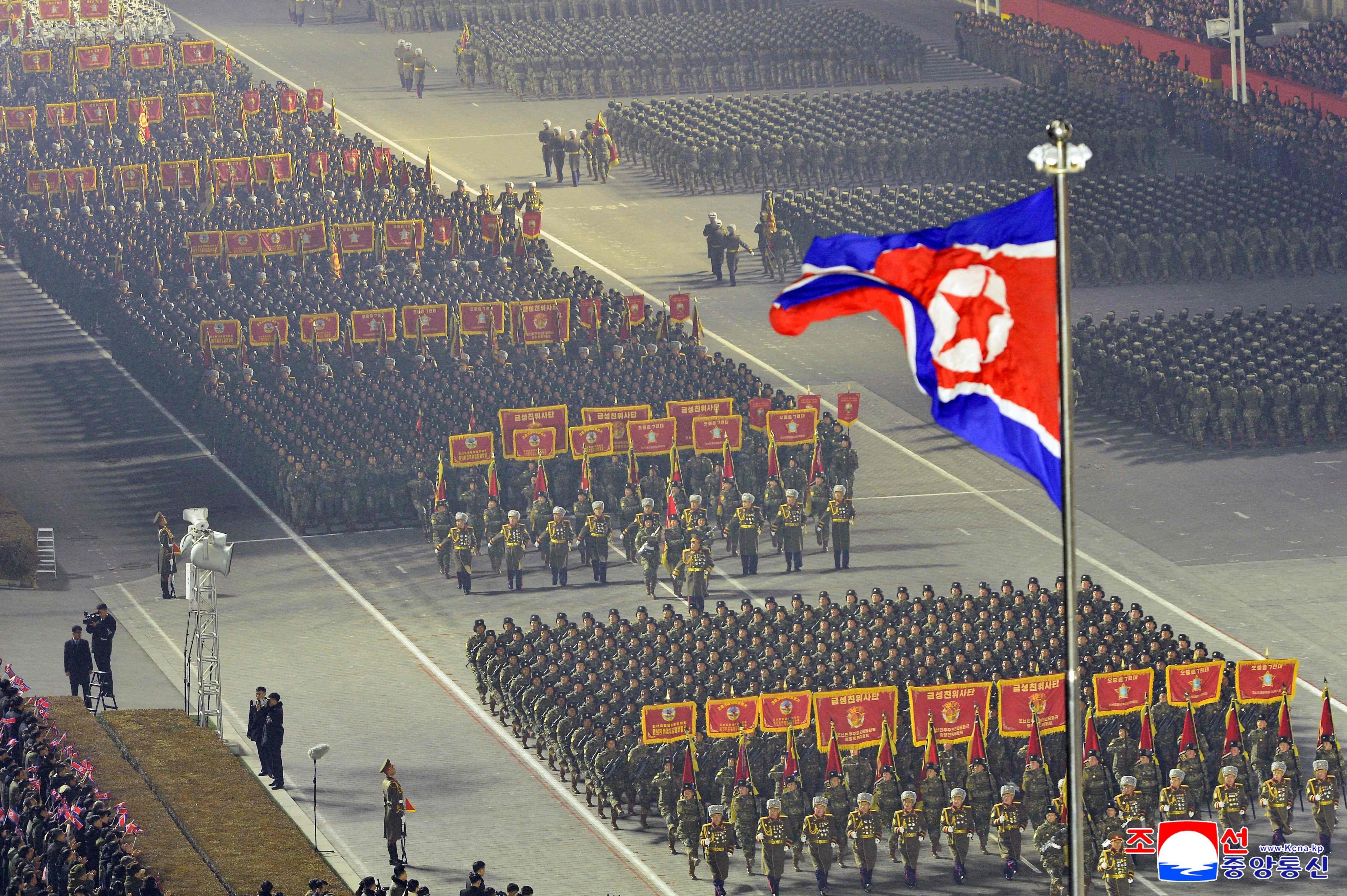 Troops march through Kim Il-Sung Square in Pyongyang for a military parade on February 25. Photo: KCNA/KNS/AFP