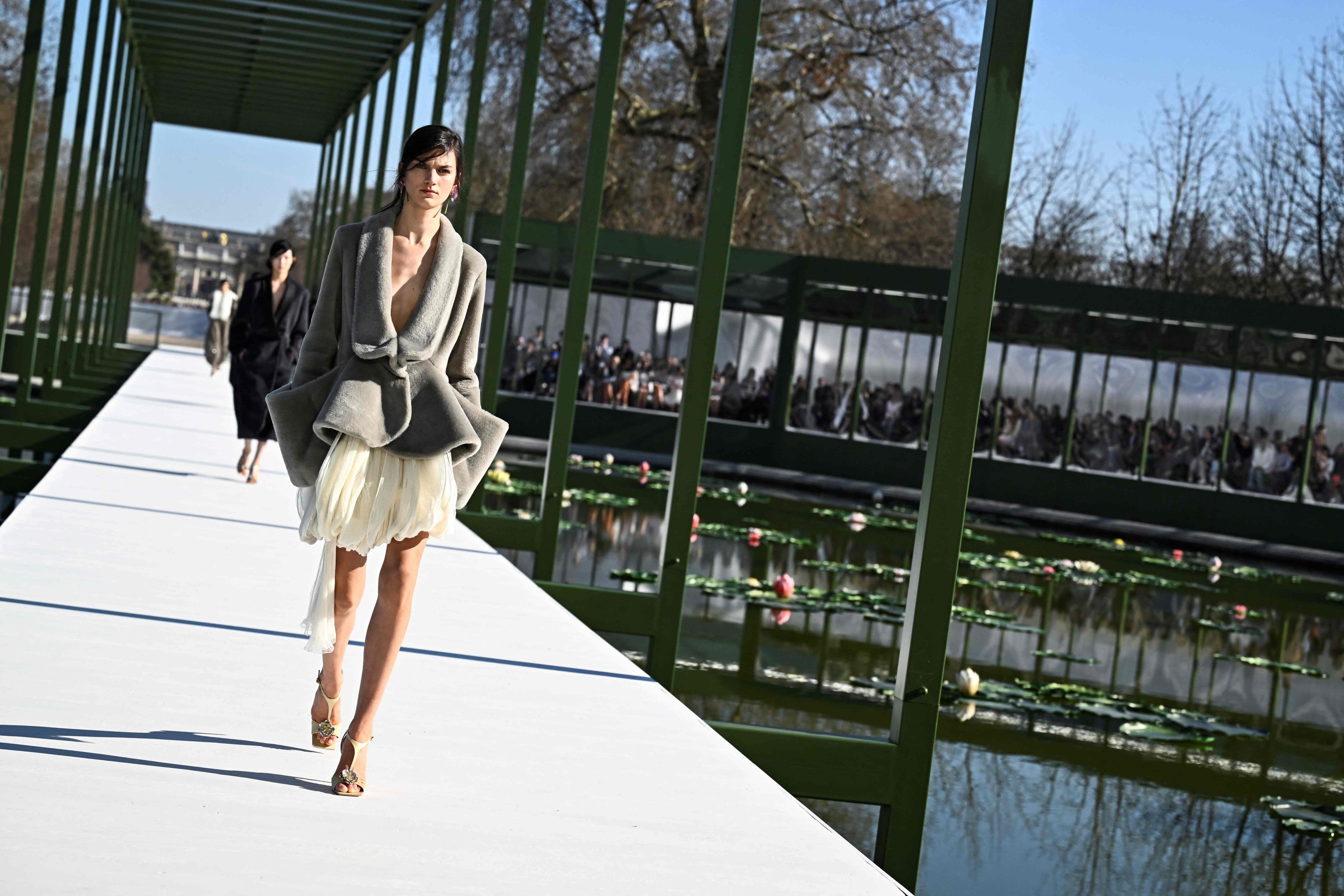 The stunning set of the Dior fall/winter 2026 show featured an artificial pond filled with water lilies. Photo: AFP