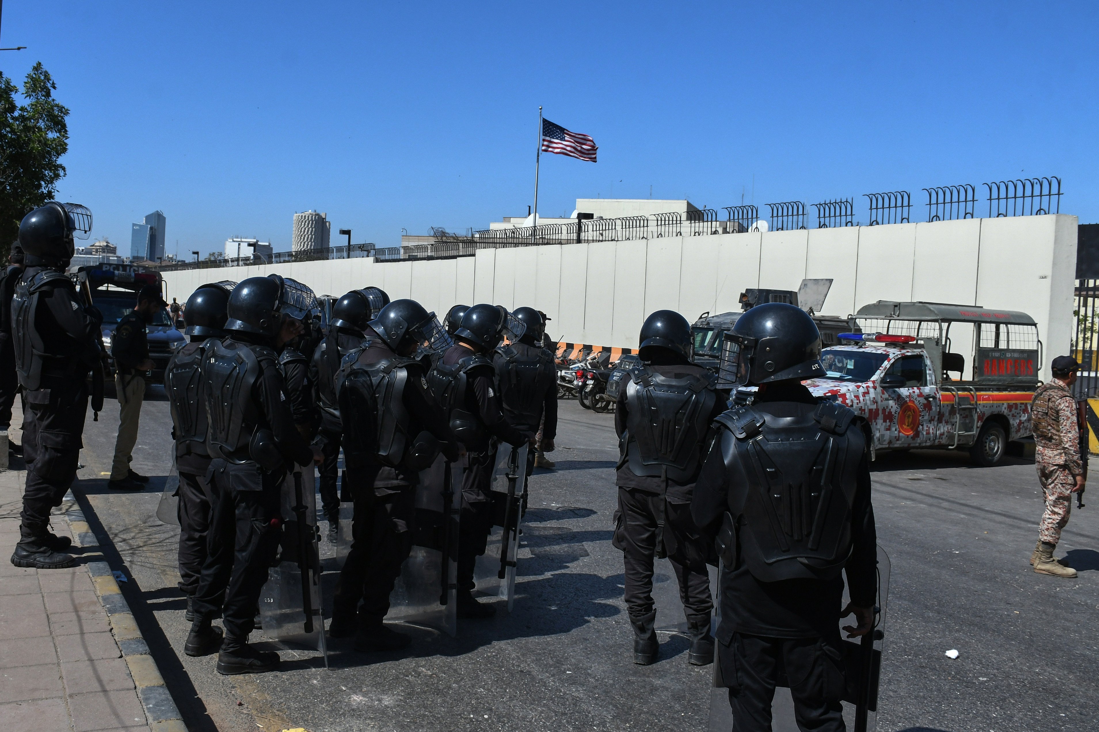 Pakistani security officers stand outside the US consulate in Karachi on Wednesday. Photo: AP
