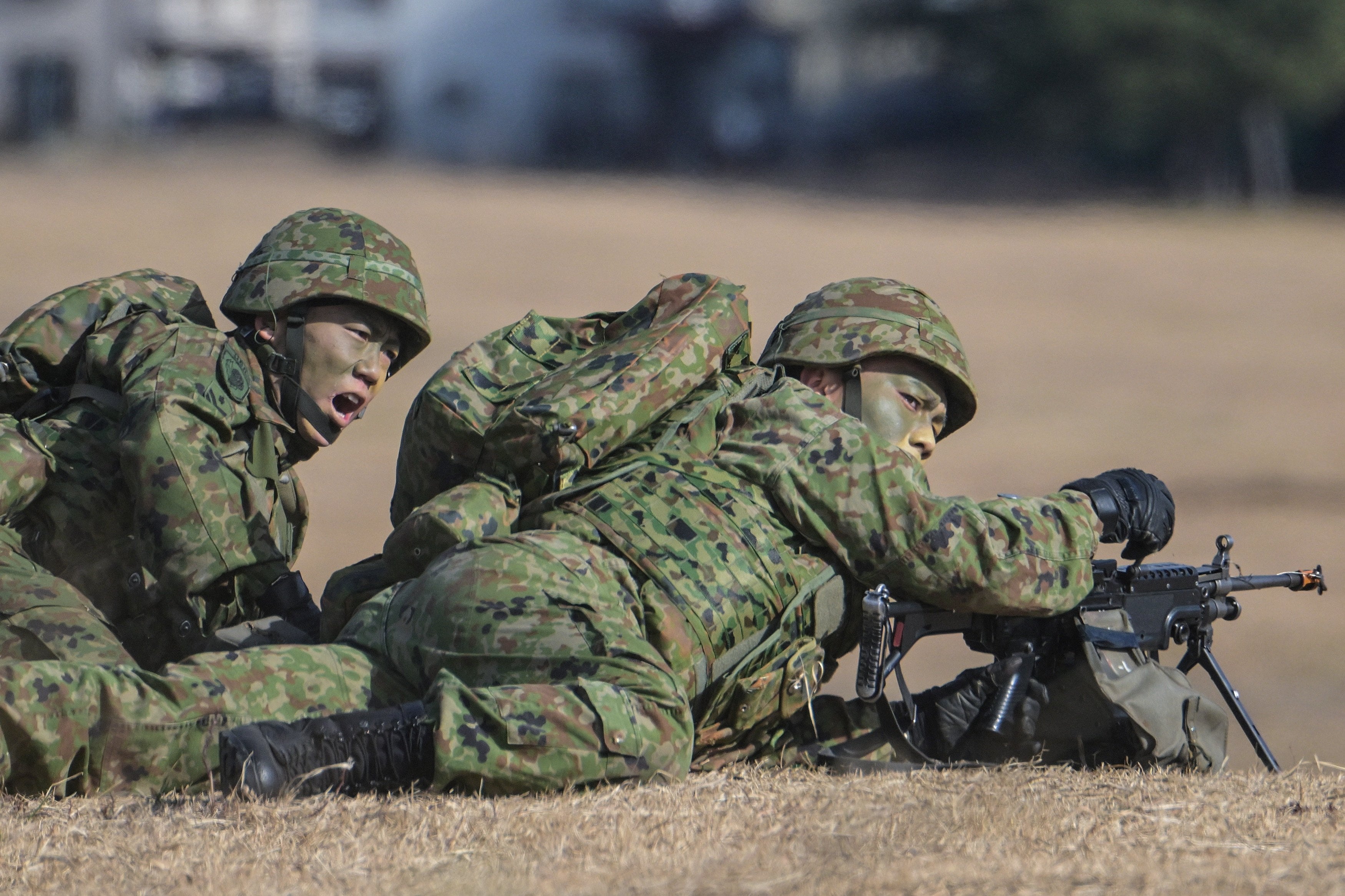 Japanese troops take position during a joint military drill in Funabashi, Chiba prefecture, on January 7. Photo: AFP
