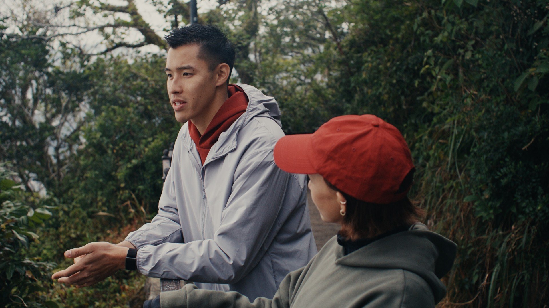 Ian Ho (left) and Victoria Tang-Owen engage in a conversation about health and wellness while on a scenic walk up to The Peak.