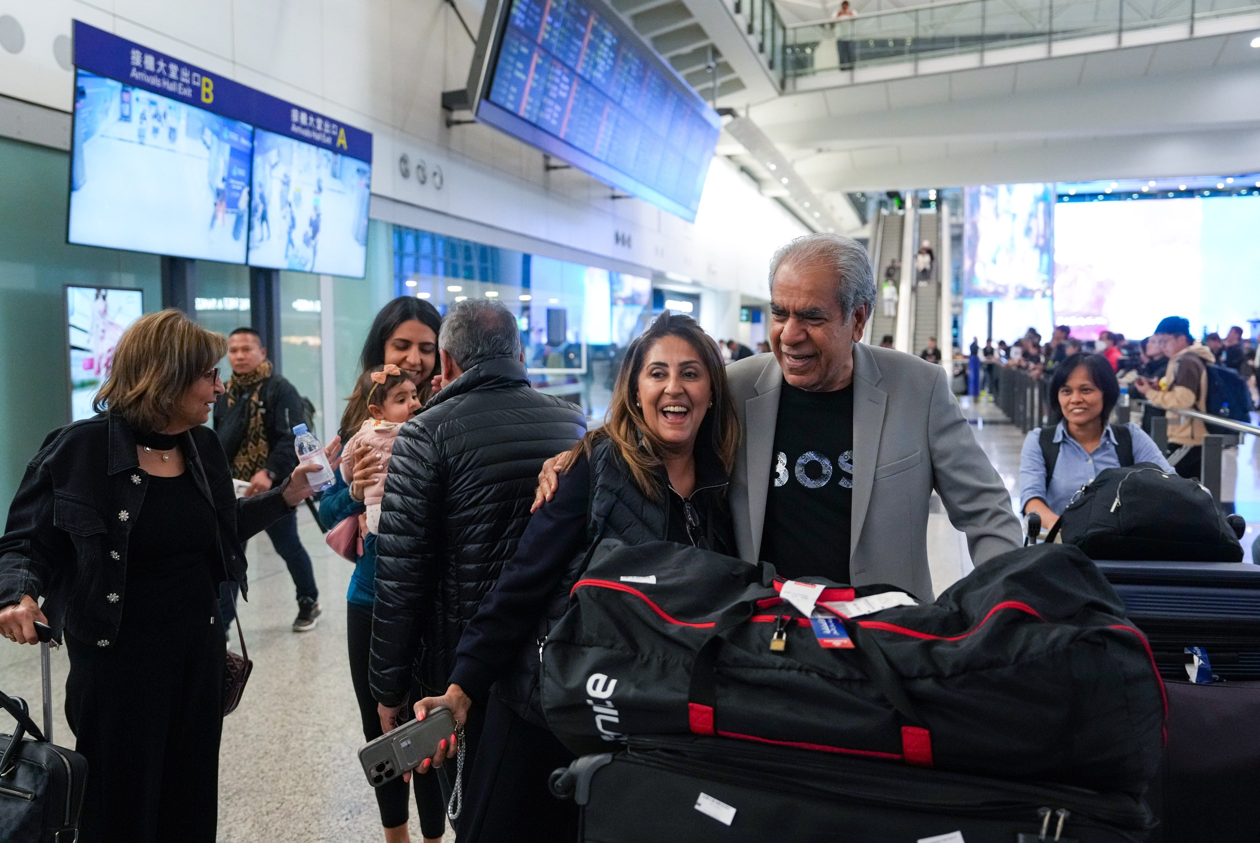 Family members were waiting for passengers at the airport’s arrival hall. Photo: Sam Tsang