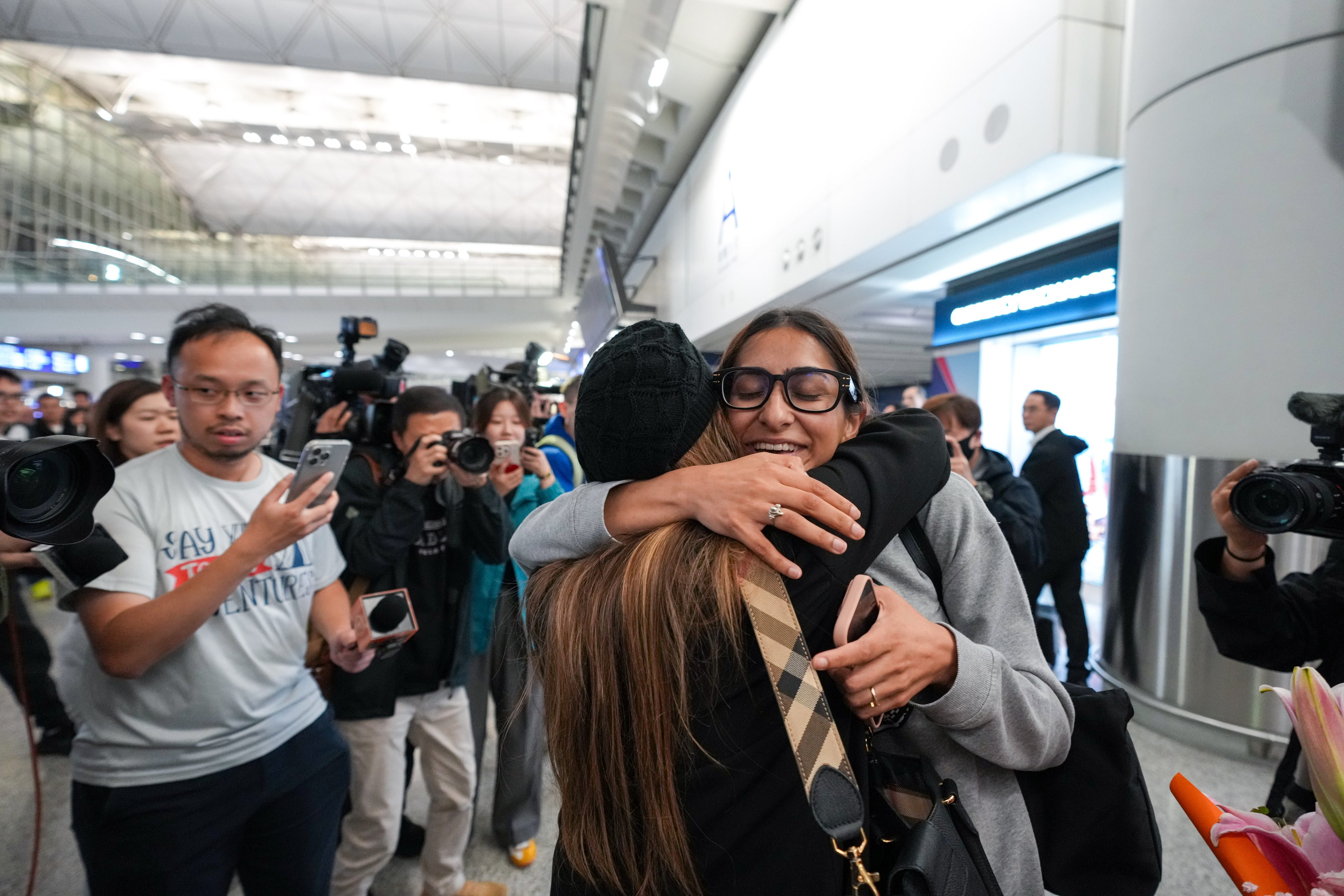 Passengers reunite with families at the Hong Kong International Airport as they return to Hong Kong from Dubai, where they had been stranded. Photo: Sam Tsang