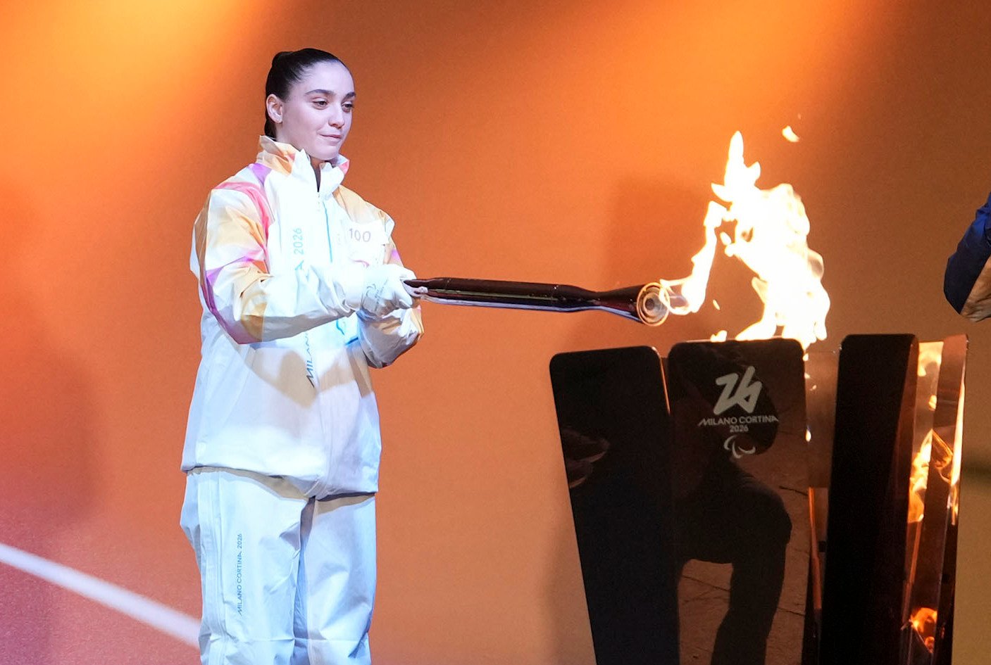 Torchbearer Matilde Villa lighting the cauldron during the Milano-Cortina 2026 Paralympics torch relay in Venice, Italy on Wednesday. Photo: Xinhua