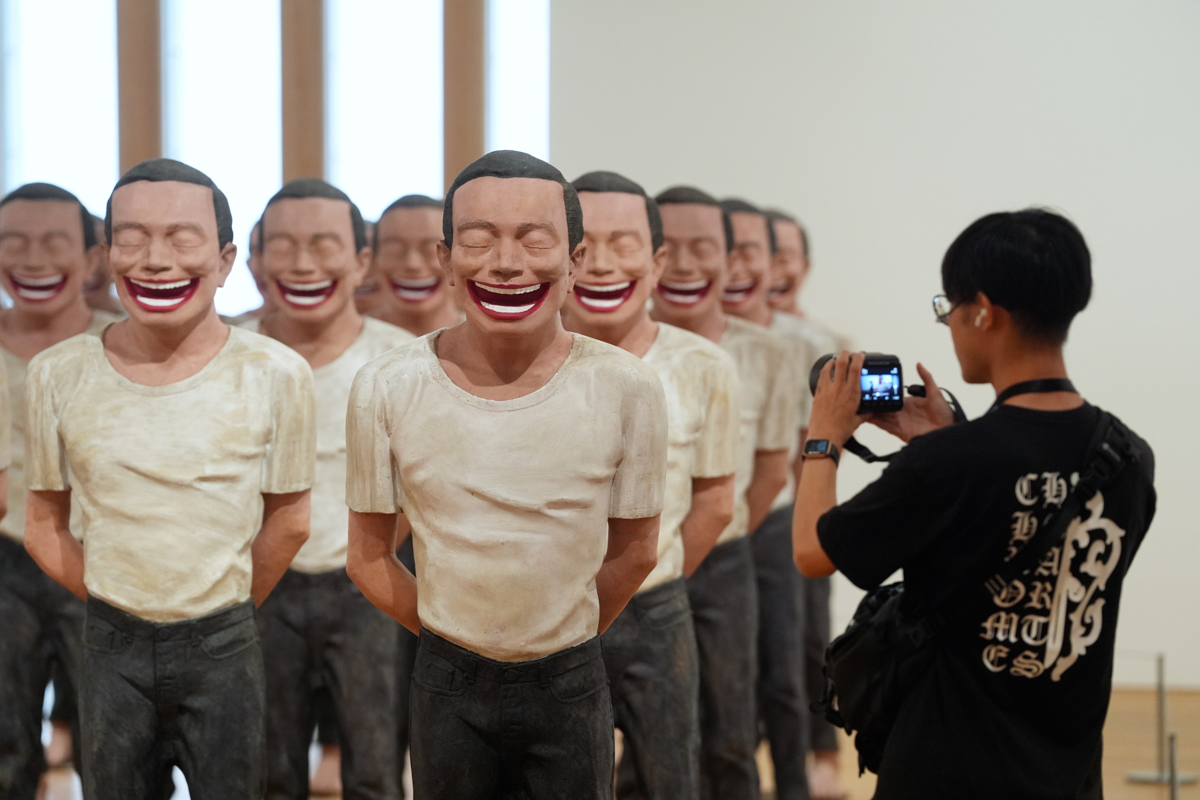 The artwork “2000 A.D.” by Yue Minjun exhibited in the Sigg Collection: Inner Worlds at M+ museum in Hong Kong. Photo: Elson Li