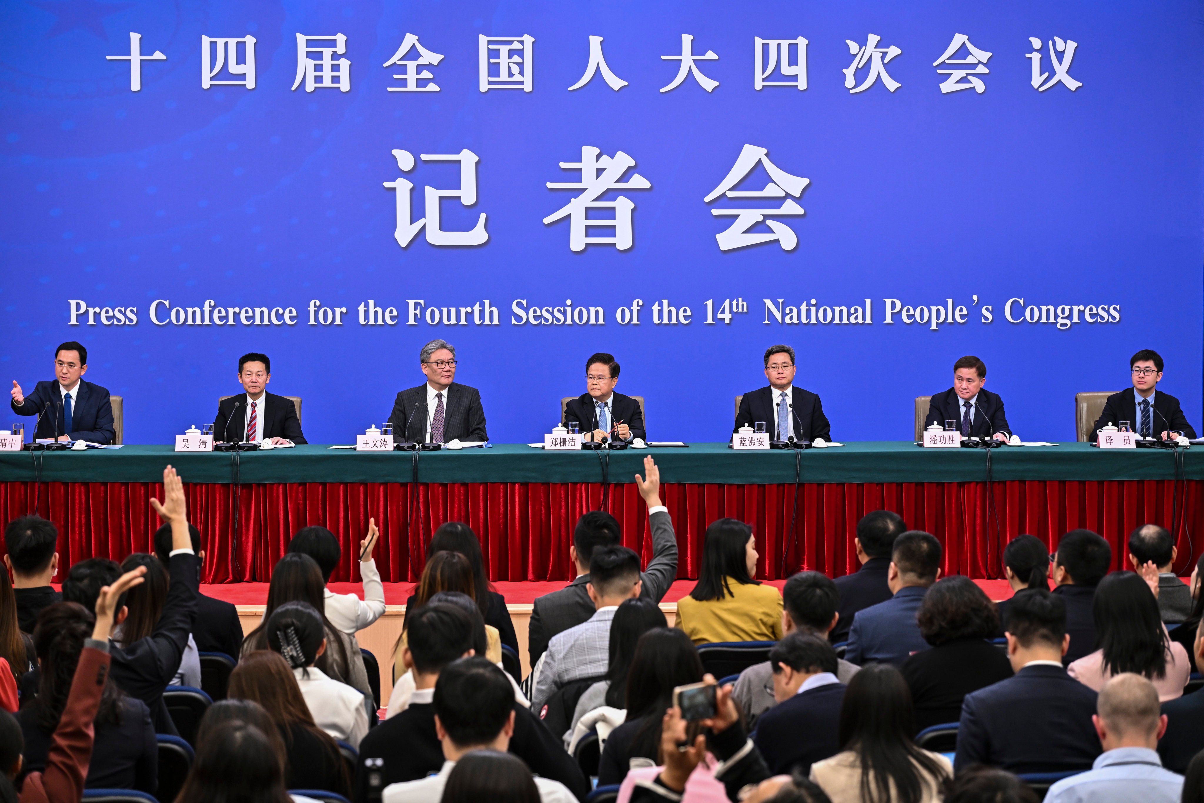 China’s top economic officials answer questions at a press conference in Beijing on March 6, 2026. Photo: Xinhua