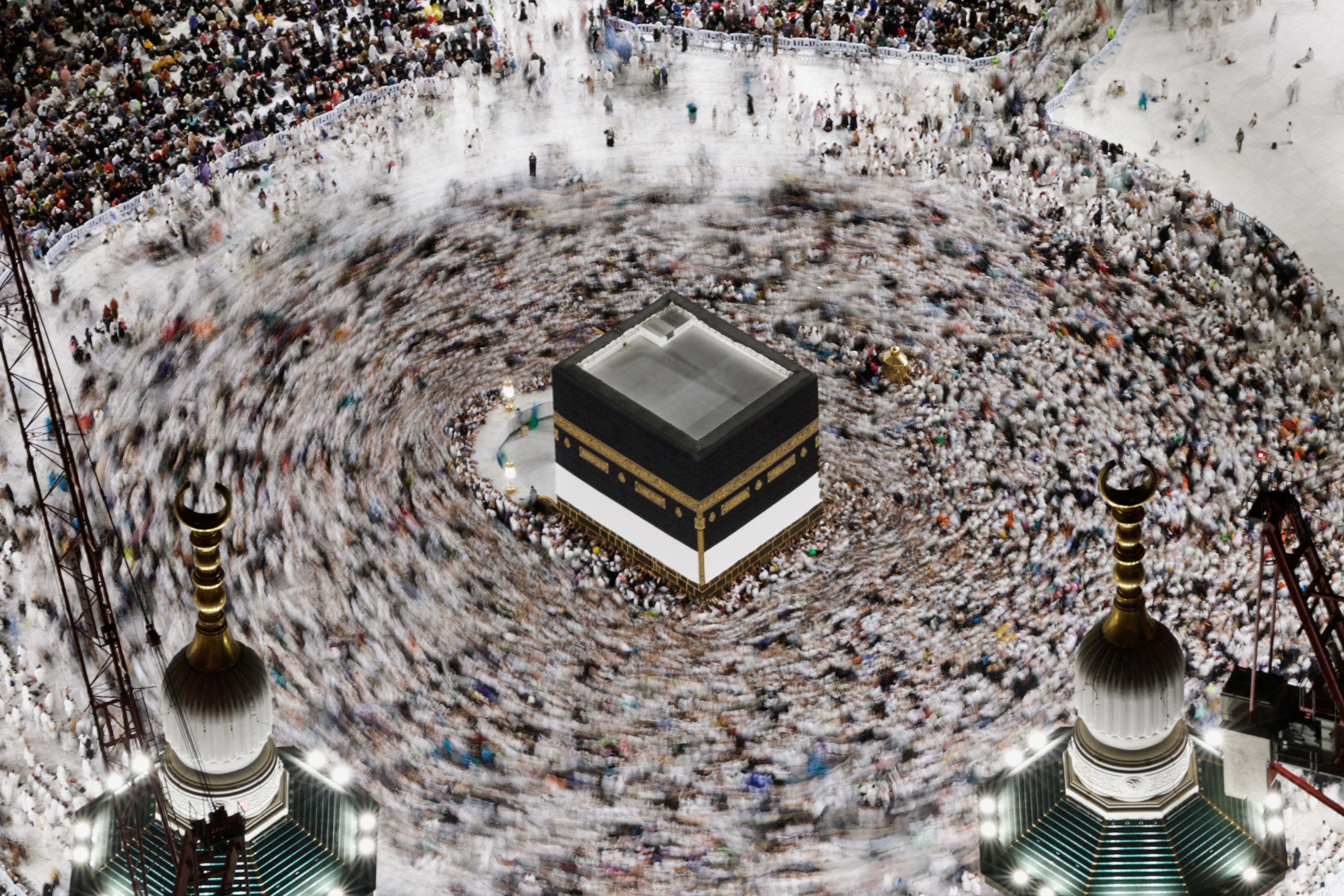 Pilgrims circle Kaaba as they perform Tawaf at the Grand Mosque, ahead of the annual haj pilgrimage, in Mecca, Saudi Arabia, June 11, 2024. REUTERS/Mohammed Torokman      TPX IMAGES OF THE DAYas