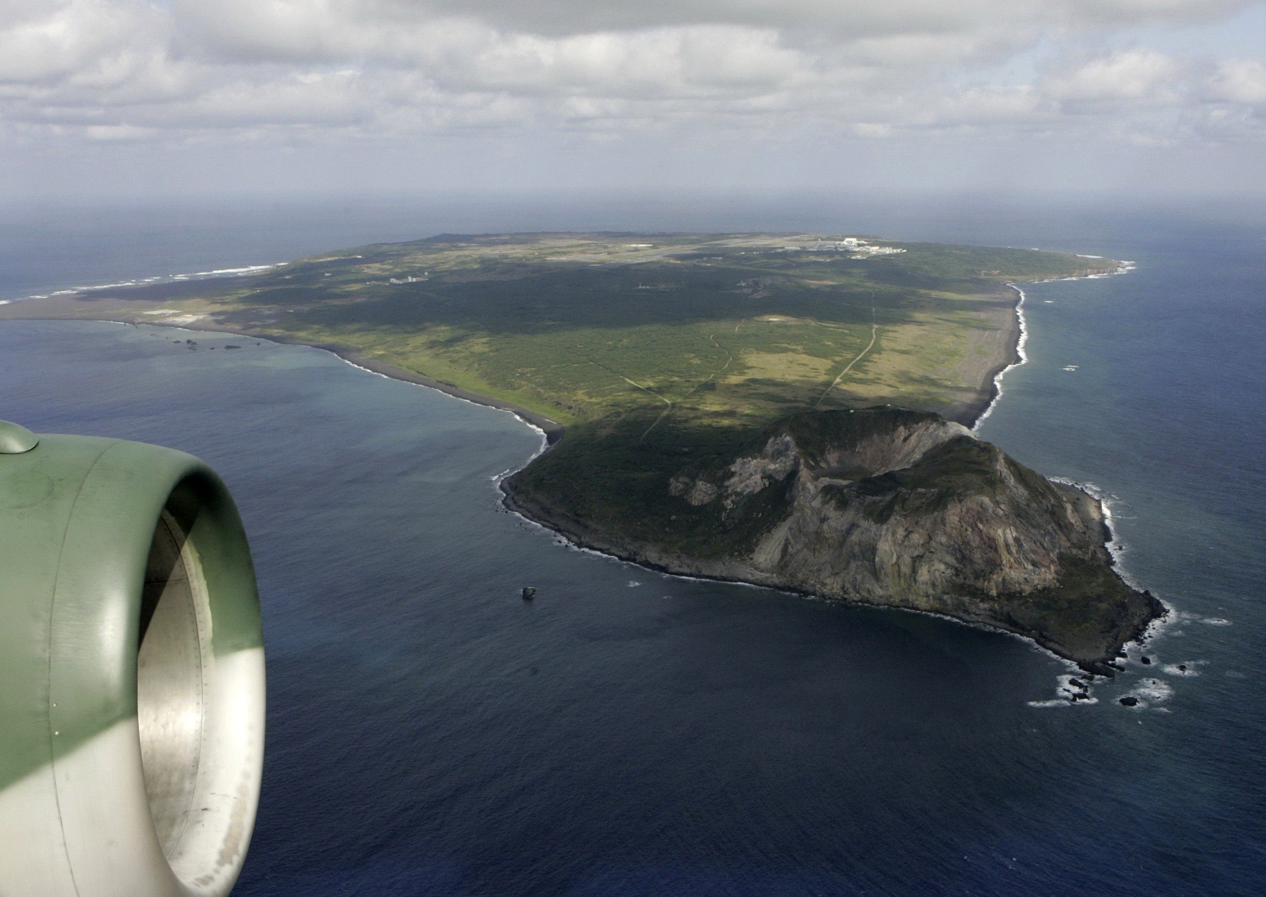The island of Iwo Jima, with Mount Suribachi in the foreground, is seen from a Japanese Air Self-Defence Force transport plane. Photo: Reuters