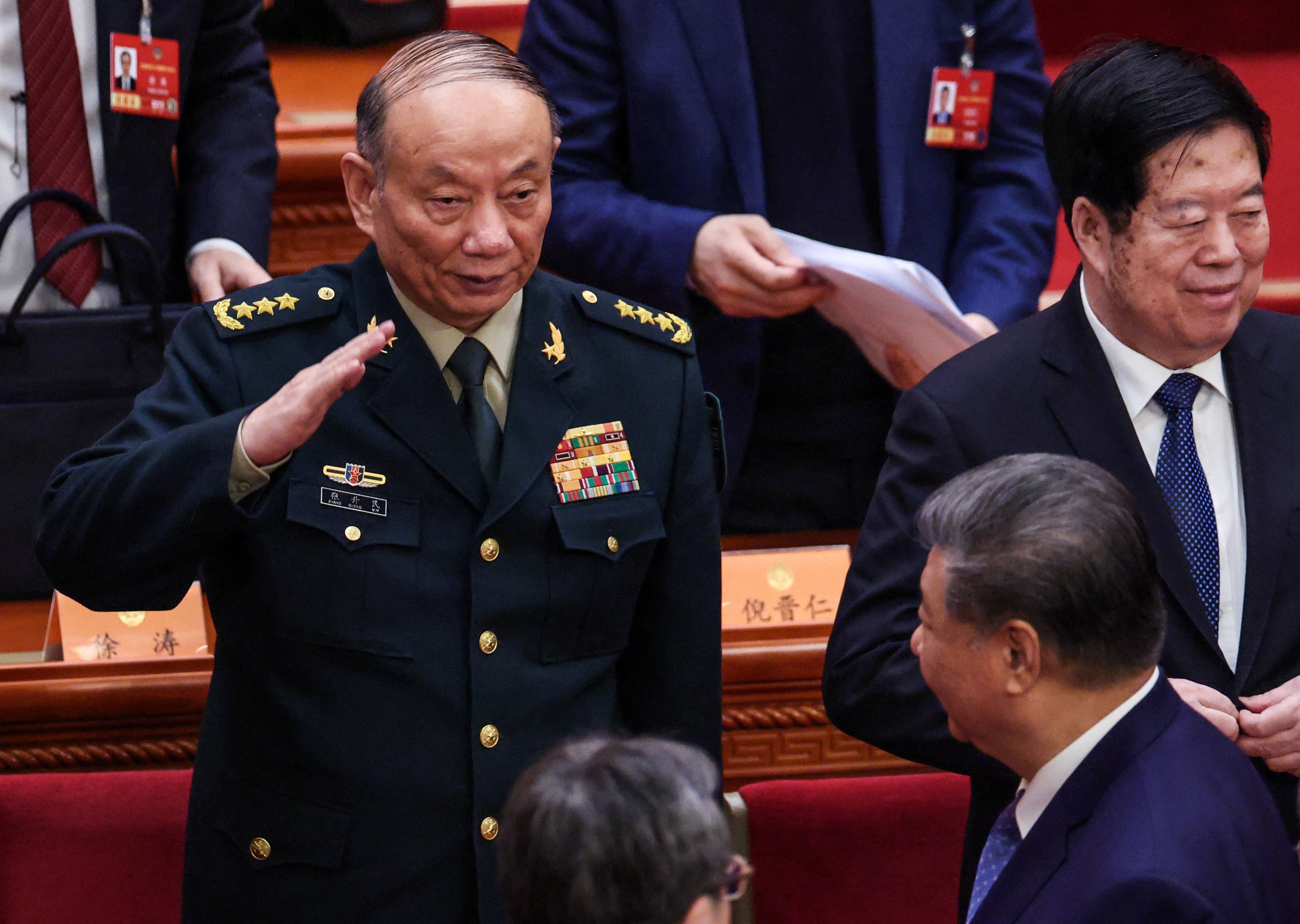 Zhang Shengmin, vice-chairman of the Central Military Commission, salutes Chinese President Xi Jinping in the Great Hall of the People in Beijing on Wednesday. Photo: Reuters