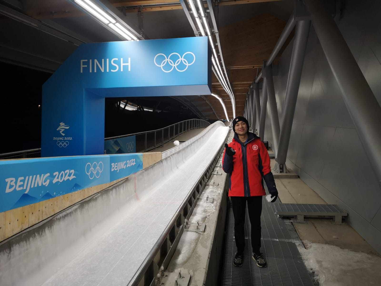 Hong Kong alpine skier Adrian Yung at the Beijing Winter Olympic Games slalom finish line after skiing at the Yanqing National Alpine Ski Centre. Photo: Handout
