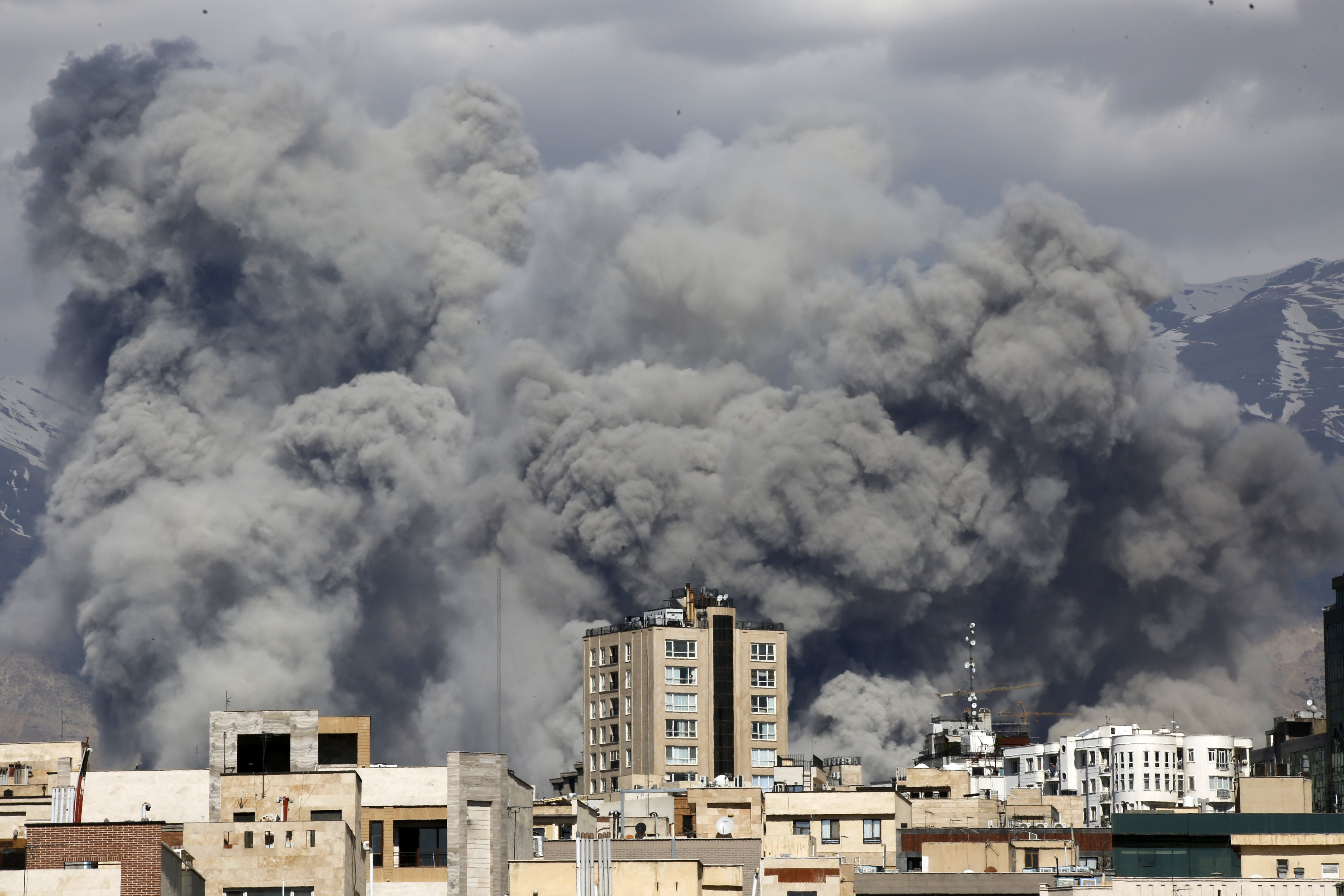 Smoke rises above buildings in Tehran after air strikes on March 1. The escalating conflict in the Middle East is leading to tight supplies of sulphur in China. Photo: Getty Images