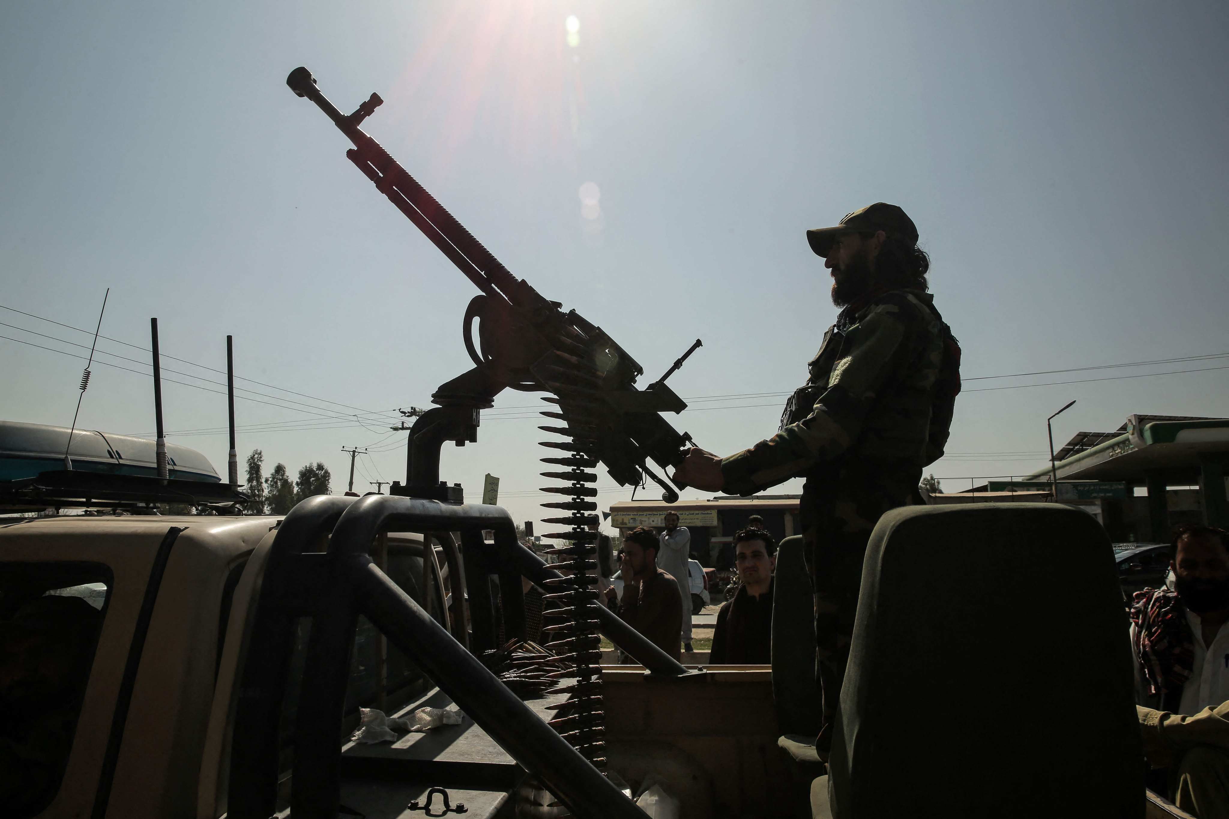A Taliban security guard rides an armed vehicle on the outskirts of Jalalabad, Afghanistan, on February 28. Photo: AFP
