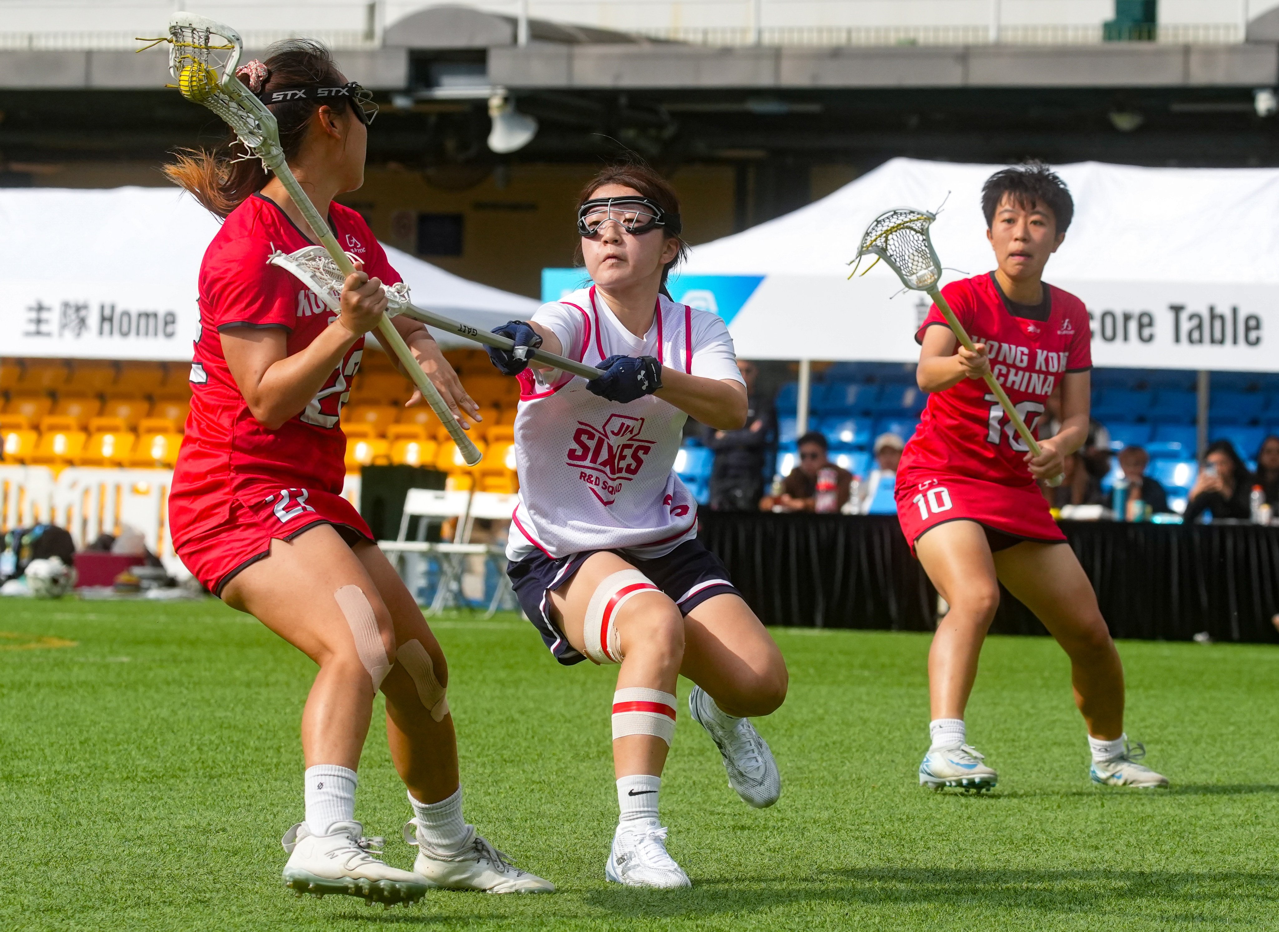 Hong Kong (red) playing against JLA Sixes in the women’s bronze medal game at last year’s Hong Kong International Lacrosse Sixes at Hong Kong Football Club, Happy Valley. Photo: Sun Yeung