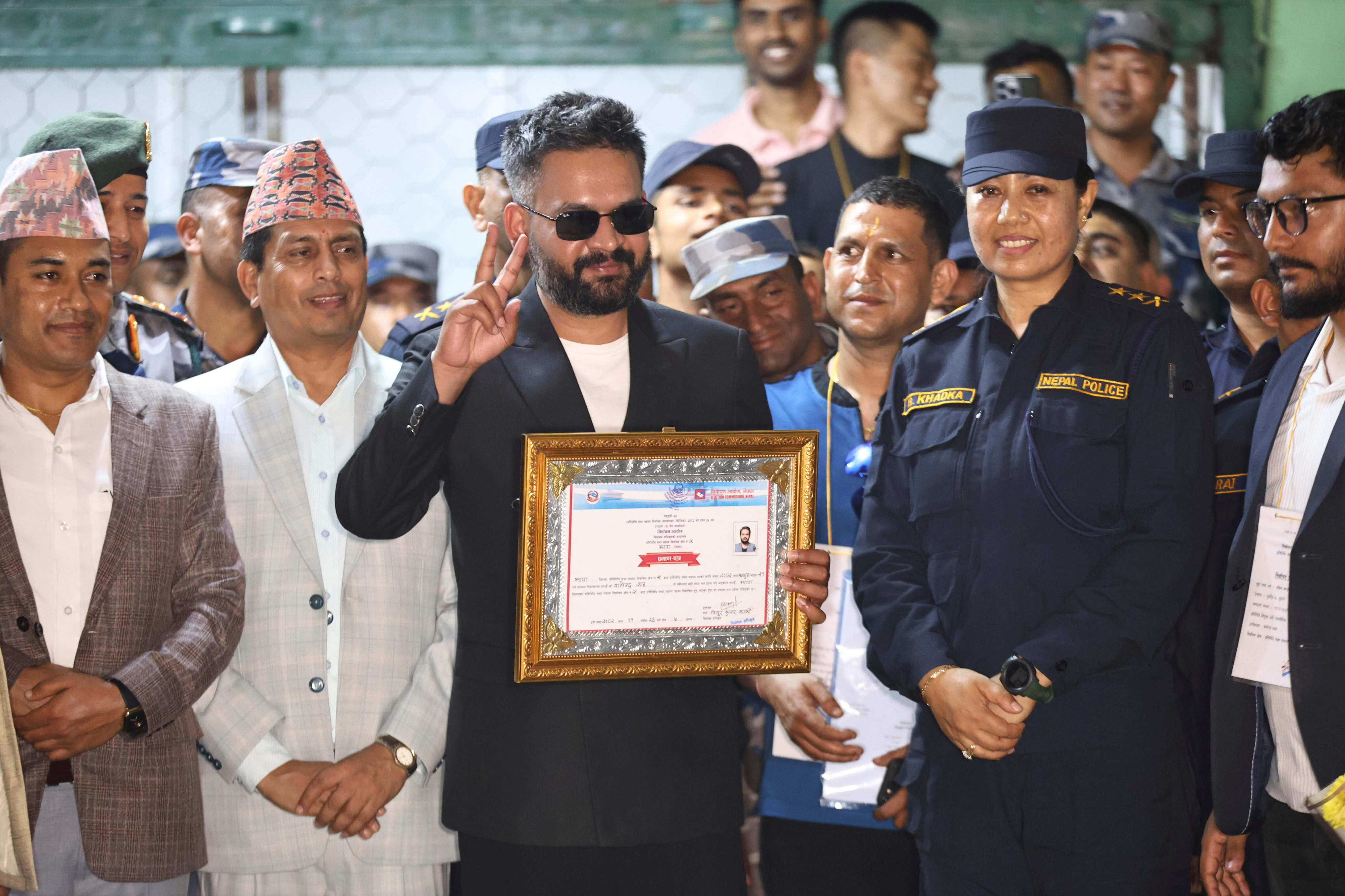 Balendra Shah, 35, receives his victory certificate on Sunday after defeating former Prime Minister K.P. Sharma Oli in Nepal’s parliamentary election. Photo: AP