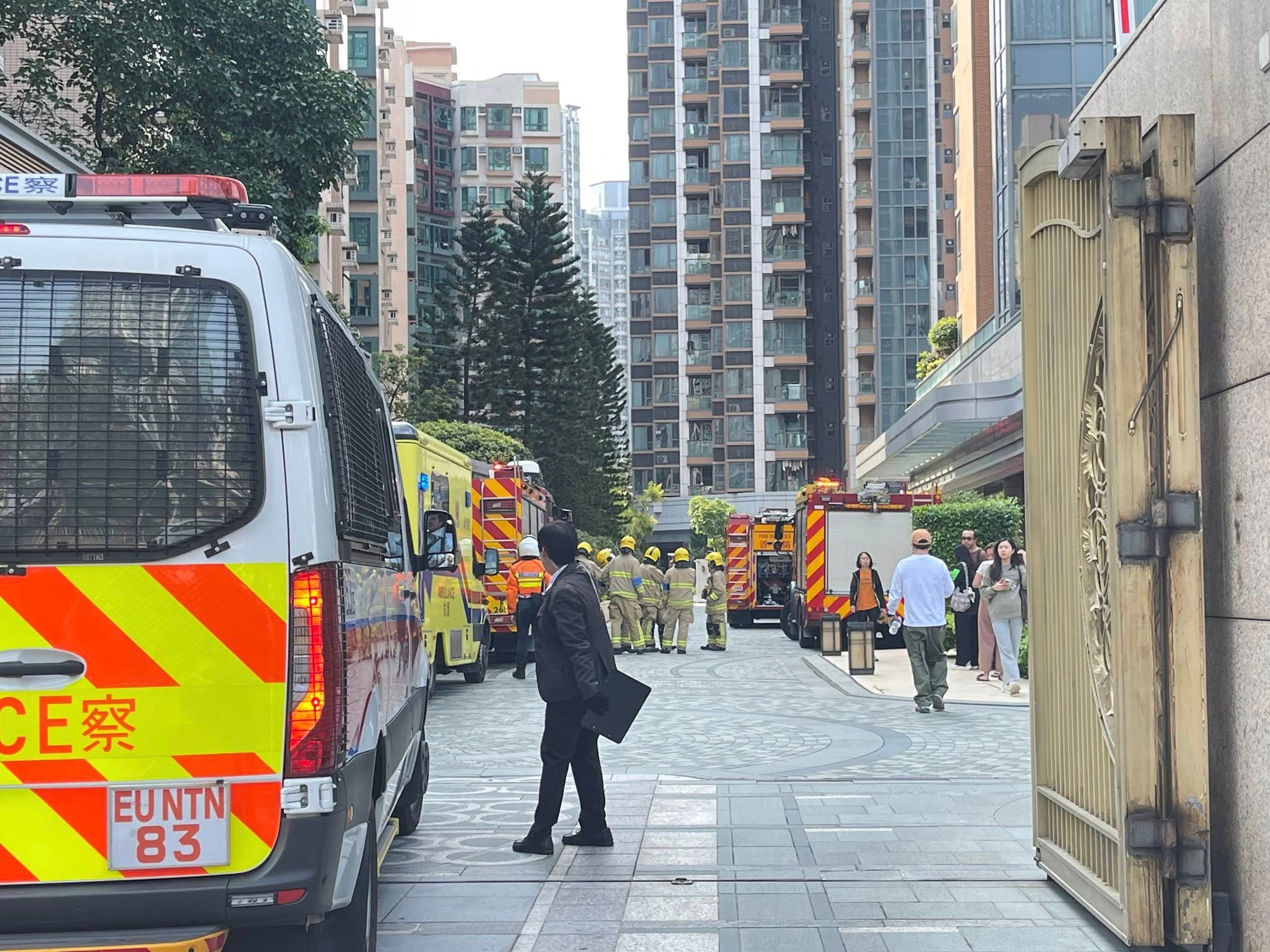 Officers arrive at the scene after a fire broke out in the flat. Photo: Handout