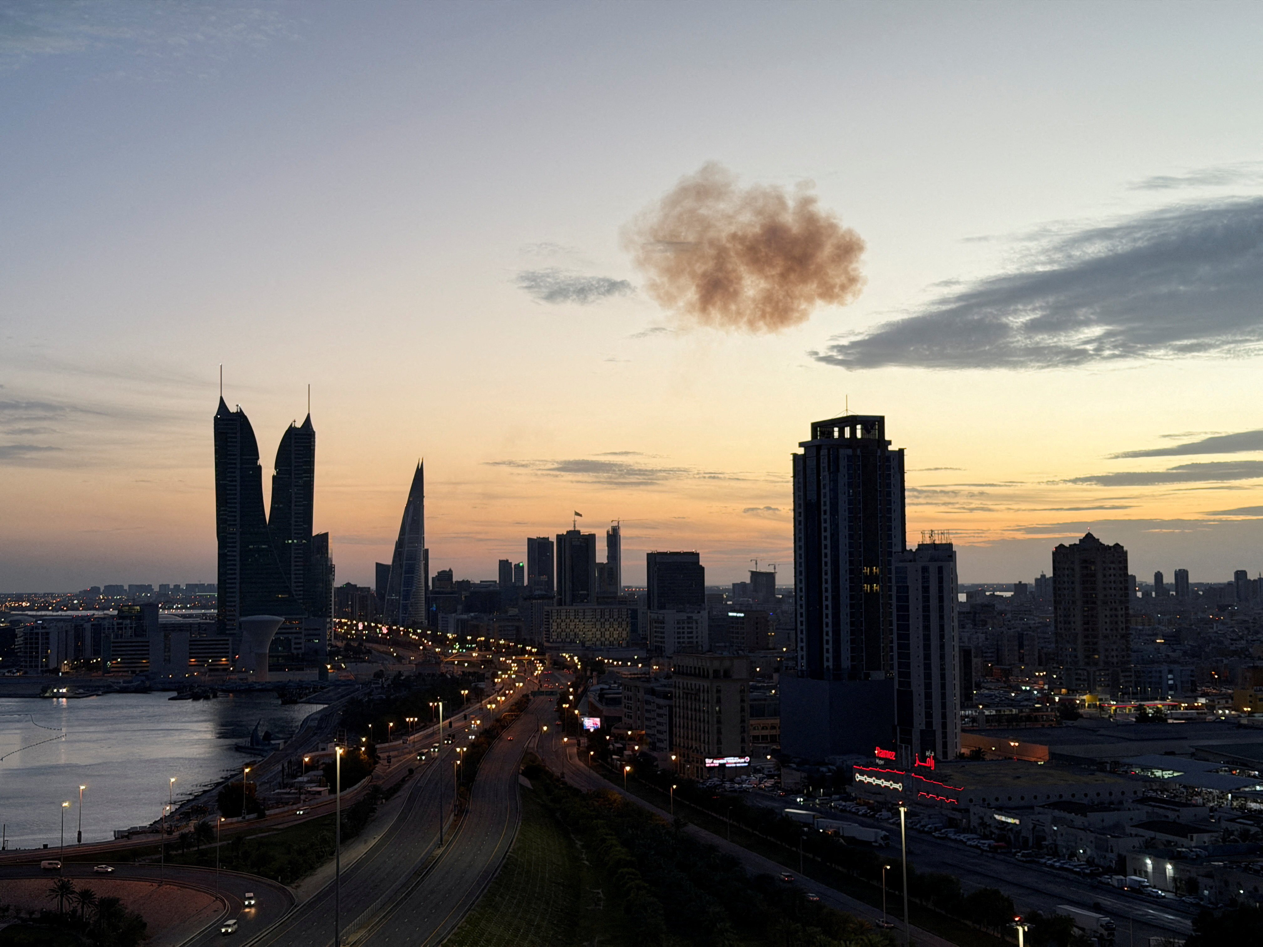 Smoke rises after an Iranian drone was intercepted over the Bahrain Financial Harbour towers in Manama on Saturday. Photo: Reuters