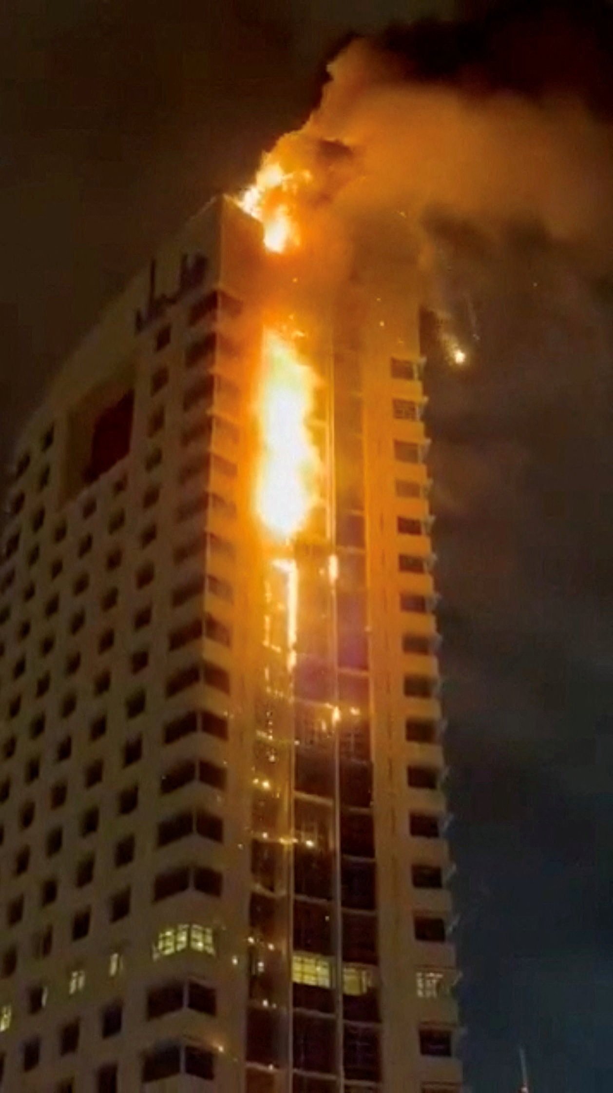 Smoke rises from a building on fire, in the aftermath of what the Kuwaiti Army says is a drone attack, amid the US-Israeli conflict with Iran, in Kuwait City on Sunday in this screengrab from a social media video. Photo: social media via Reuters