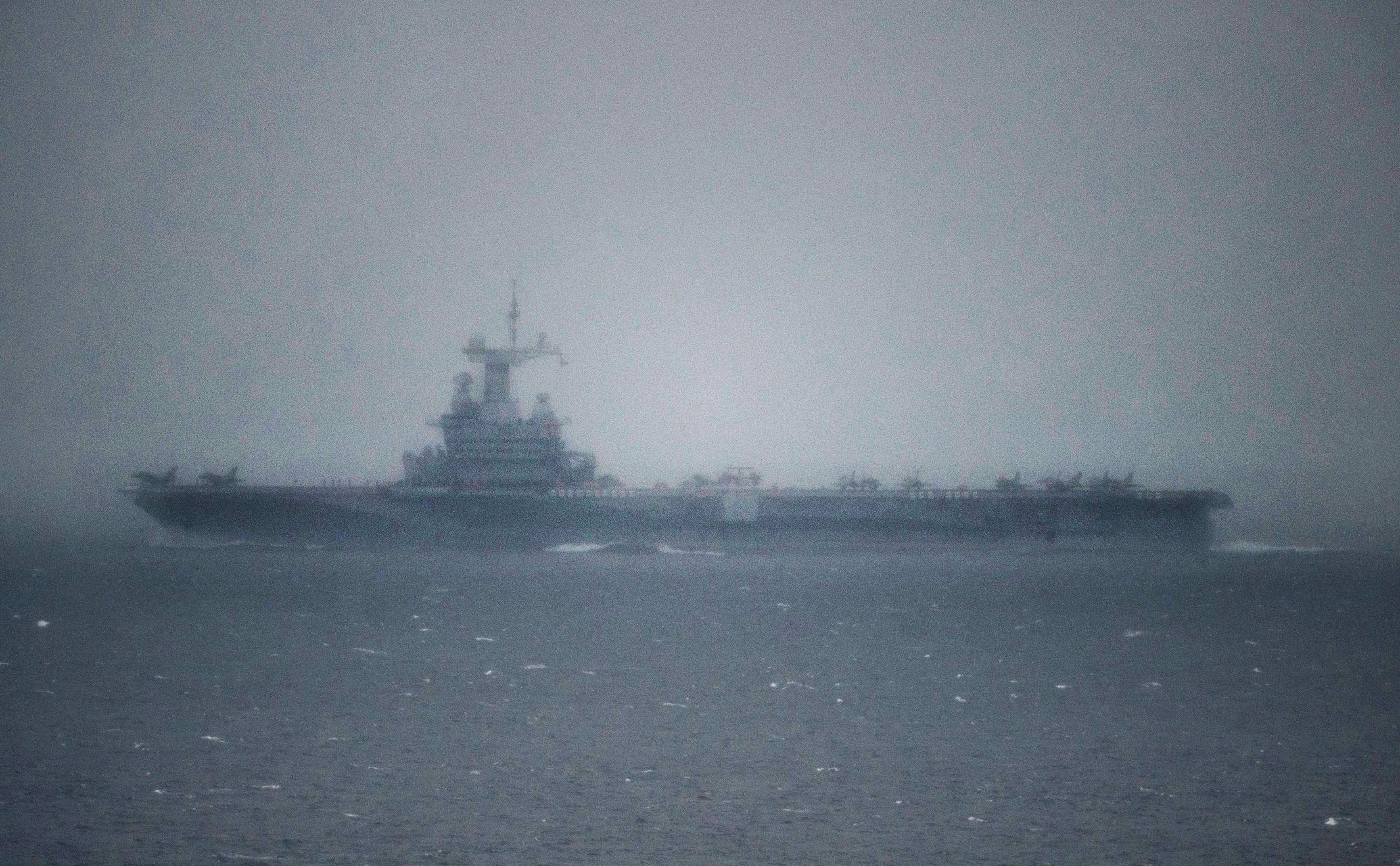 The French aircraft carrier Charles-de-Gaulle passes through the Strait of Gibraltar off the coast of southern Spain in Tarifa on March 6. Photo: AFP