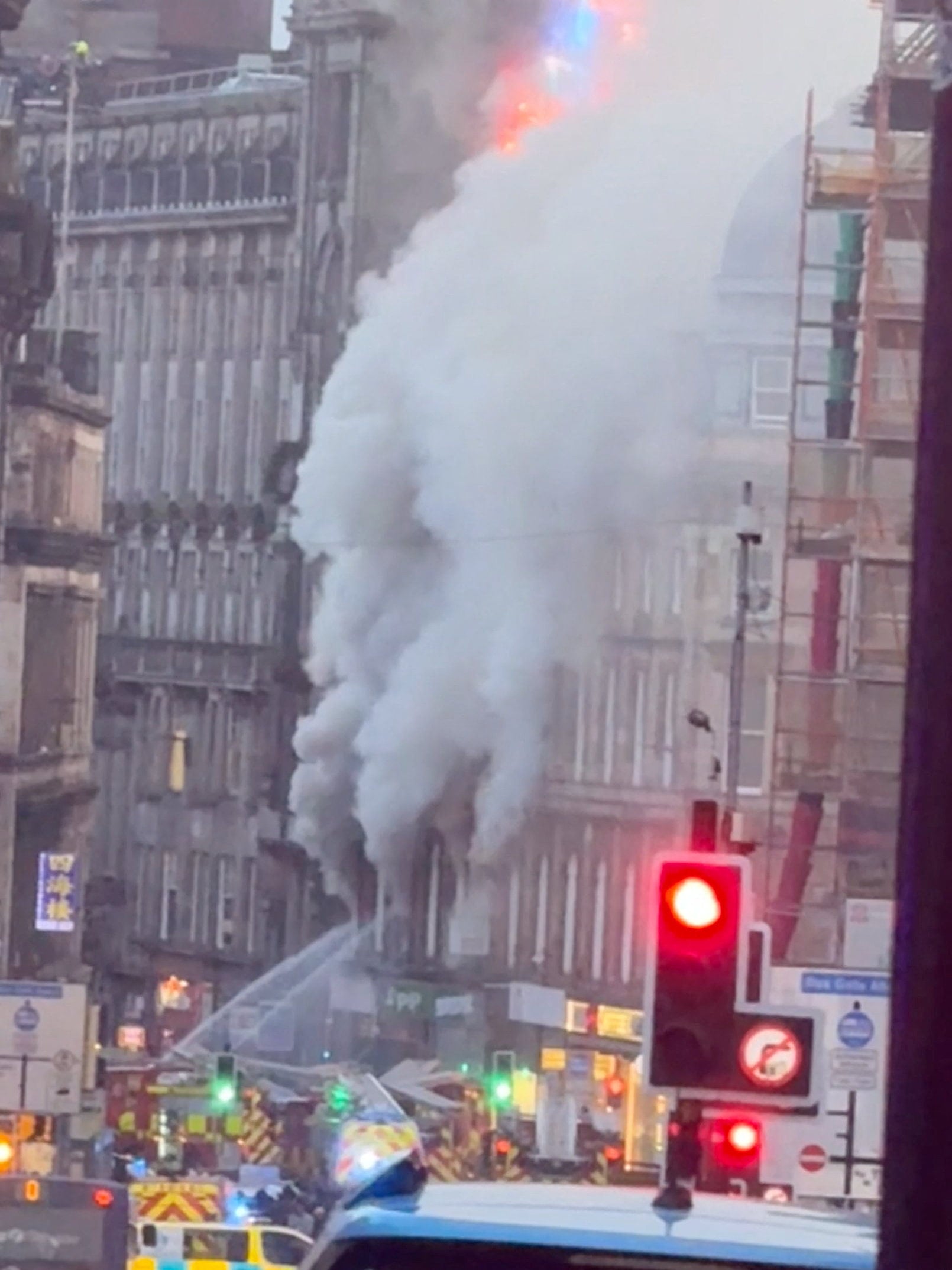 Smoke rises following a major fire at a building in Glasgow, Scotland. Photo: BRUNA GOMES via Instagram/Reuters