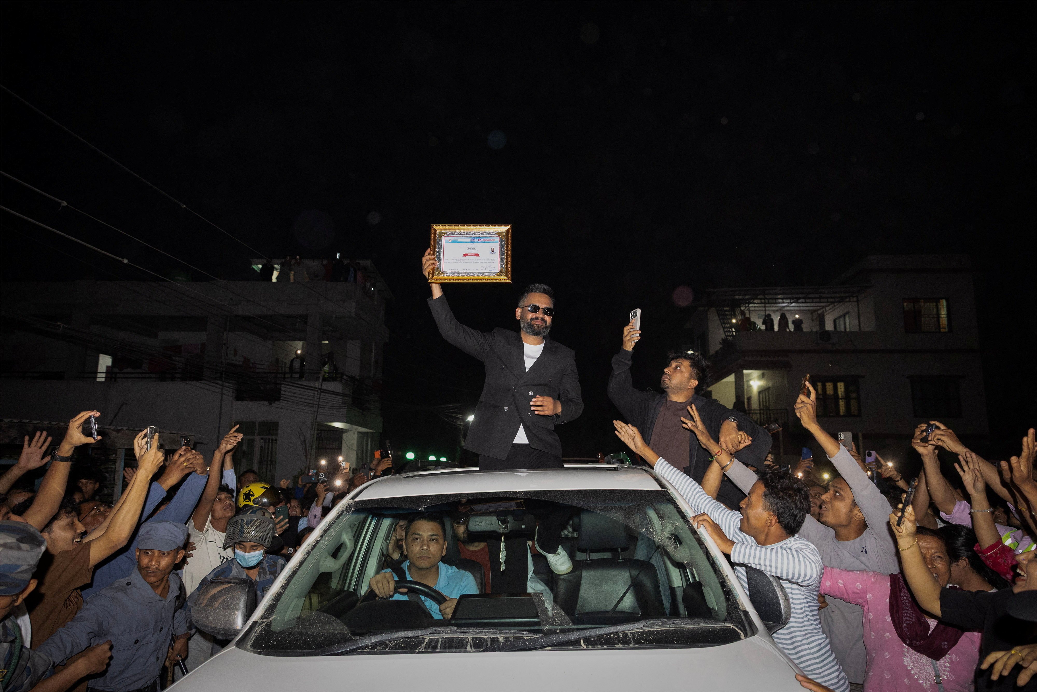 Balendra Shah, a rapper-turned-politician and the prime ministerial candidate for RSP, shows his winning certificate to his supporters as he celebrates after winning the election, in Damak, Jhapa district, Nepal, March 7, 2026. Photo: Reuters