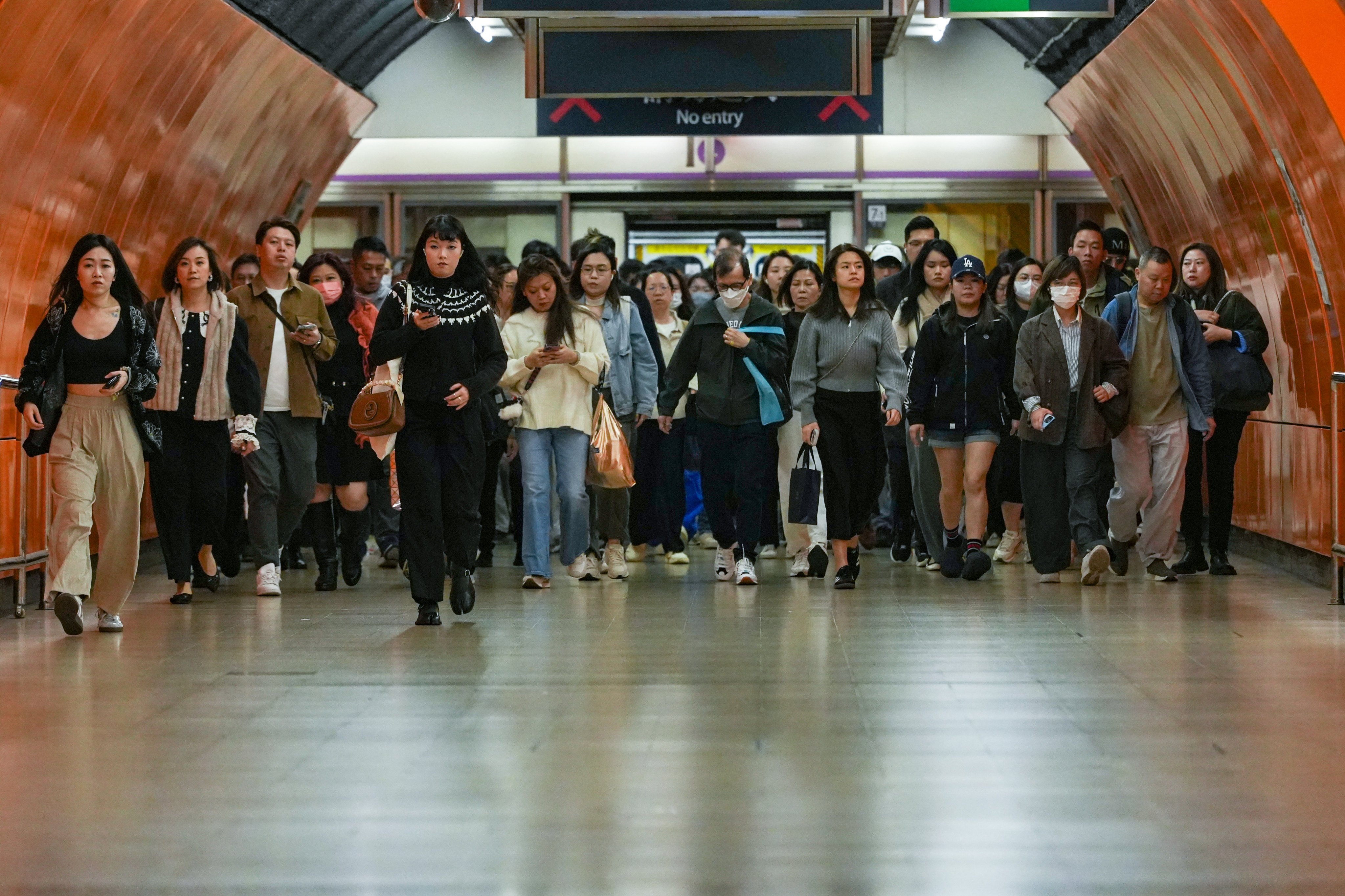 Commuters head for work in North Point on December 16, 2025. Women account for half of the government, legal and accounting workforce in Hong Kong. Photo: Sun Yeung