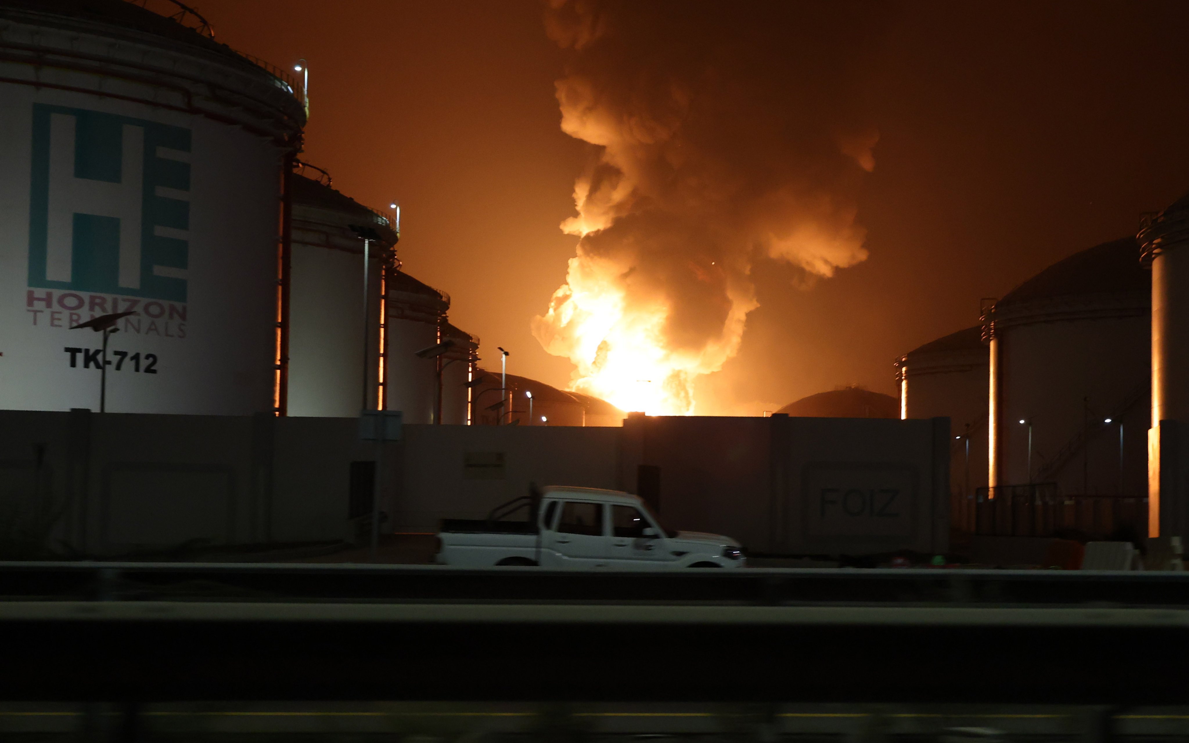 Flames rise during a fire caused by debris from an intercepted drone at the oil refinery hub in Fujairah, United Arab Emirates, on March 4. Photo: EPA