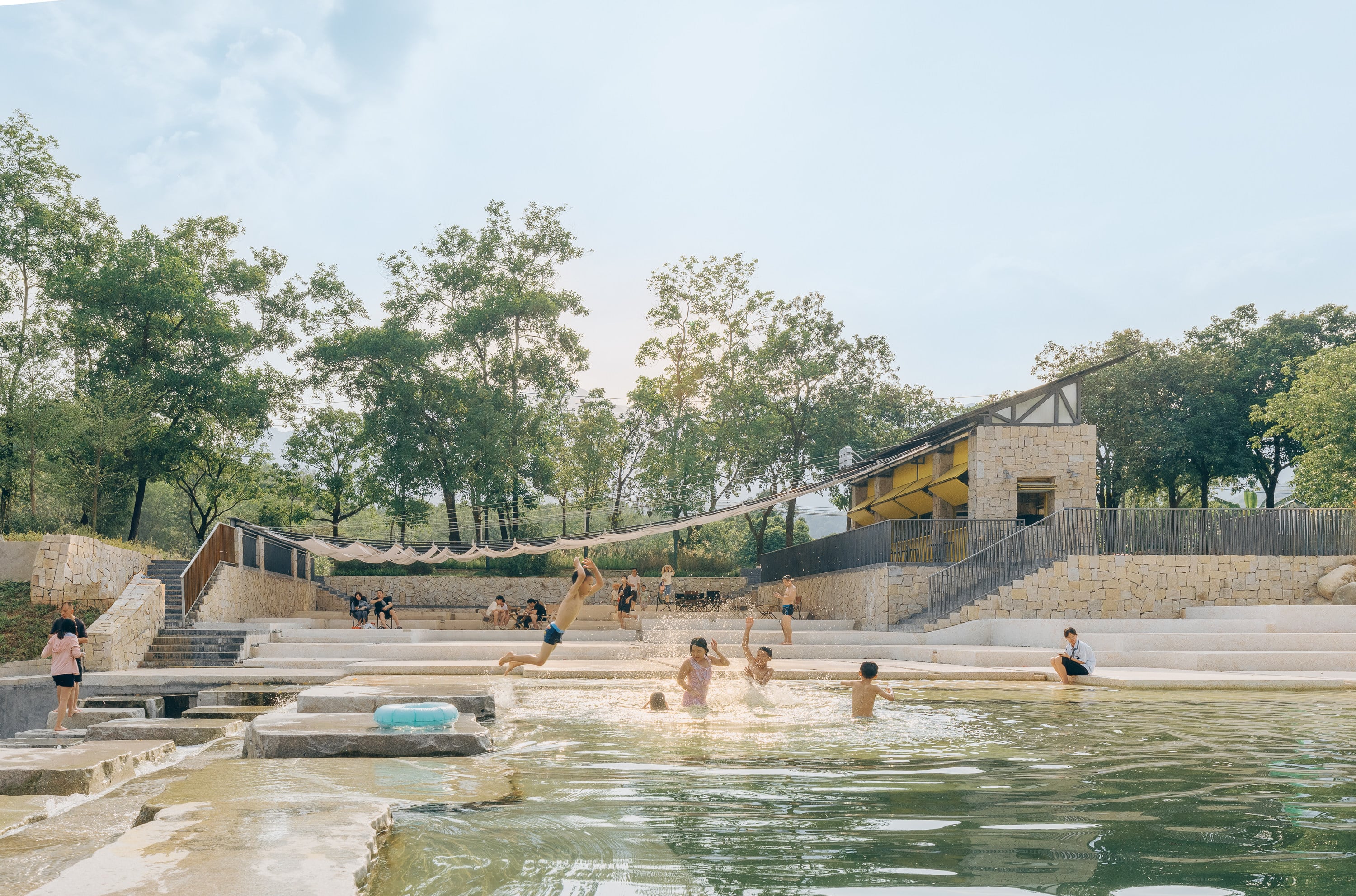 Children play in the river as adults relax on the shore at The Grand Canopy in Xialang Village, in China’s Huizhou region. Designed by Chinese architect Zhao Rongzhi and artist Zhu Xiongyi, The Grand Canopy is one of many Instagram hotspots around Huizhou’s 218 Highway. Photo: Zhu Yumeng