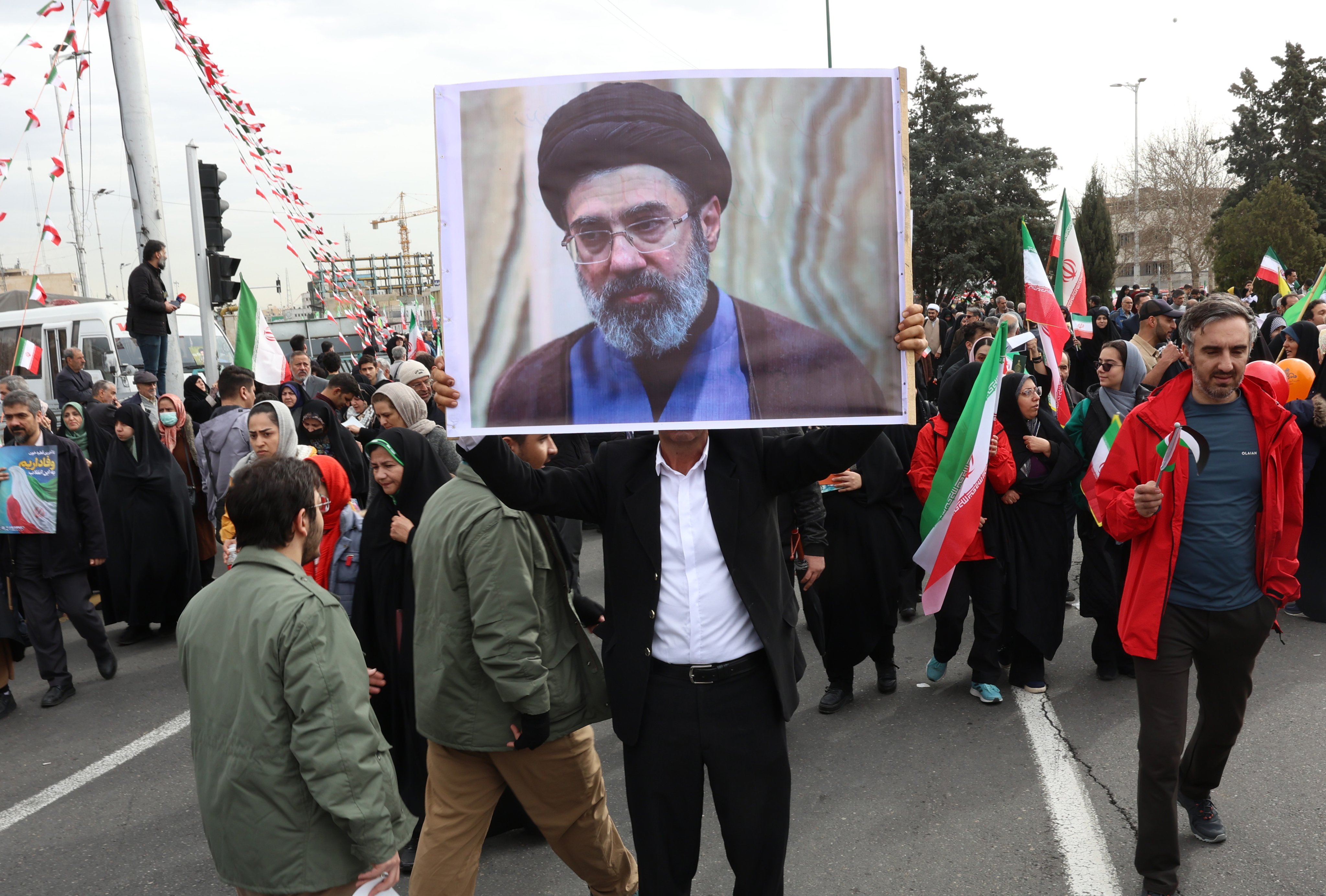A man holds a portrait of Mojtaba Khamenei following his appointment as Iran’s supreme leader by the country’s Assembly of Experts. Photo: EPA