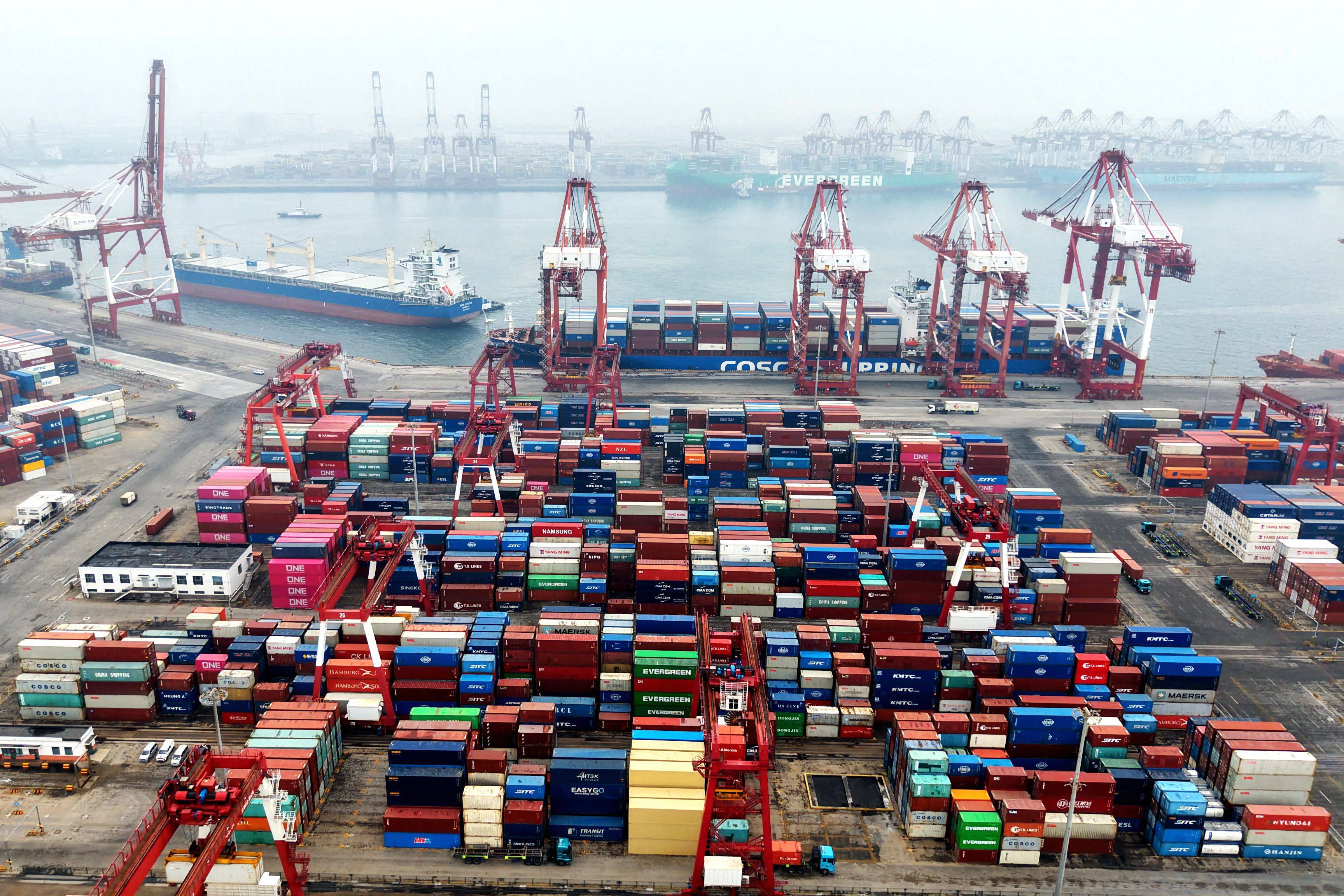 Cargo containers and ships at a port in Qingdao, Shandong province, on March 3. Photo: AFP