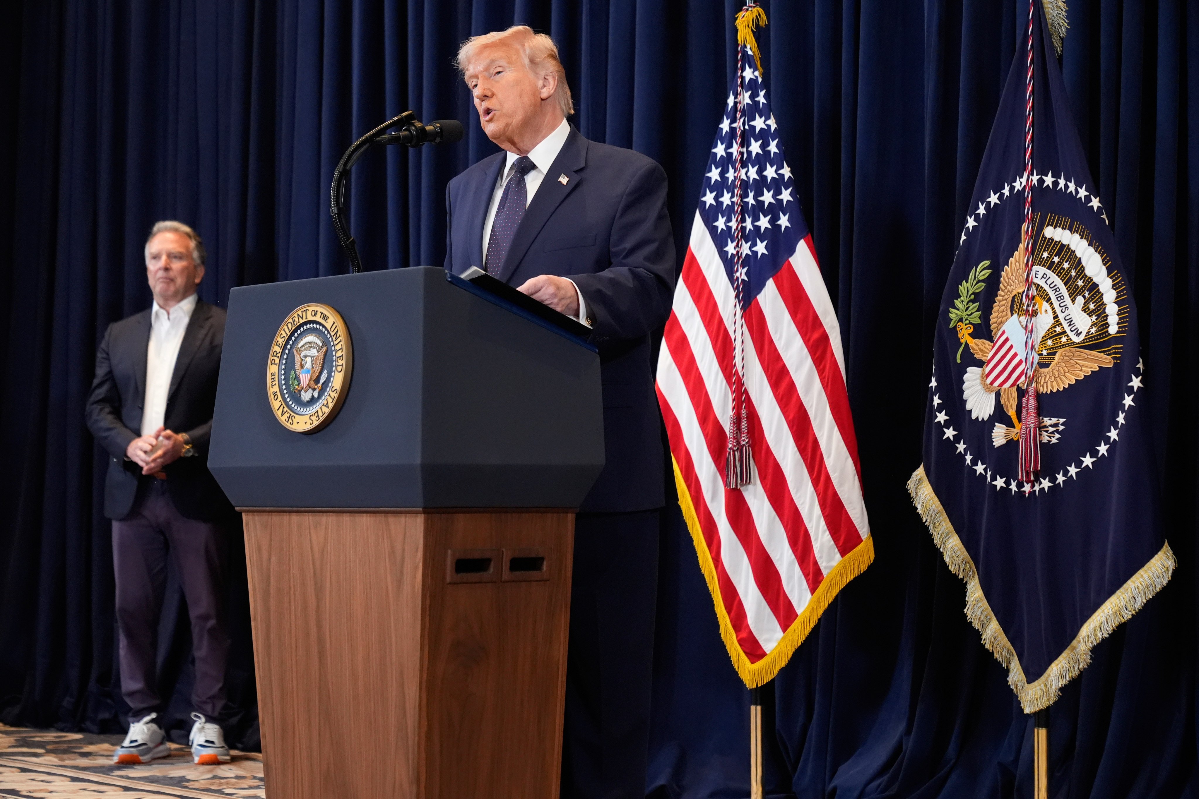 President Donald Trump speaks at a news conference, Monday, March 9, 2026, at Trump National Doral Miami in Doral, Fla., as White House Special Envoy to the Middle East Steve Witkoff listens. (AP Photo/Mark Schiefelbein)