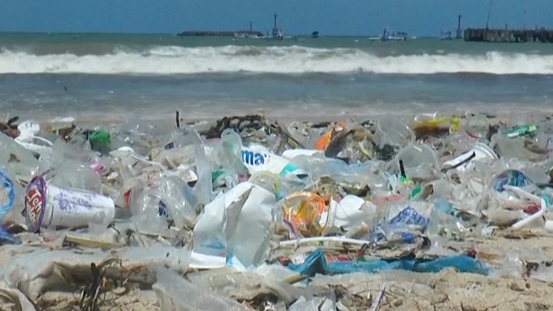 Trash covers a beach in Bali.