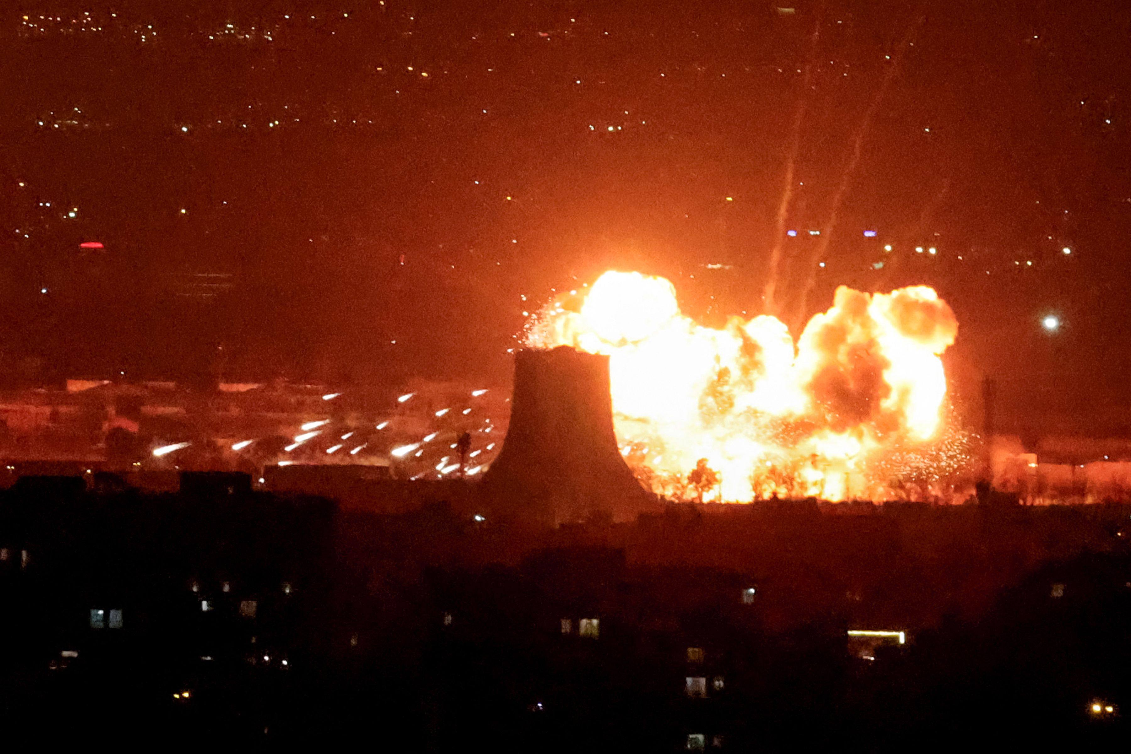 An explosion erupts following strikes near Azadi Tower in Tehran on Saturday. Photo: AFP