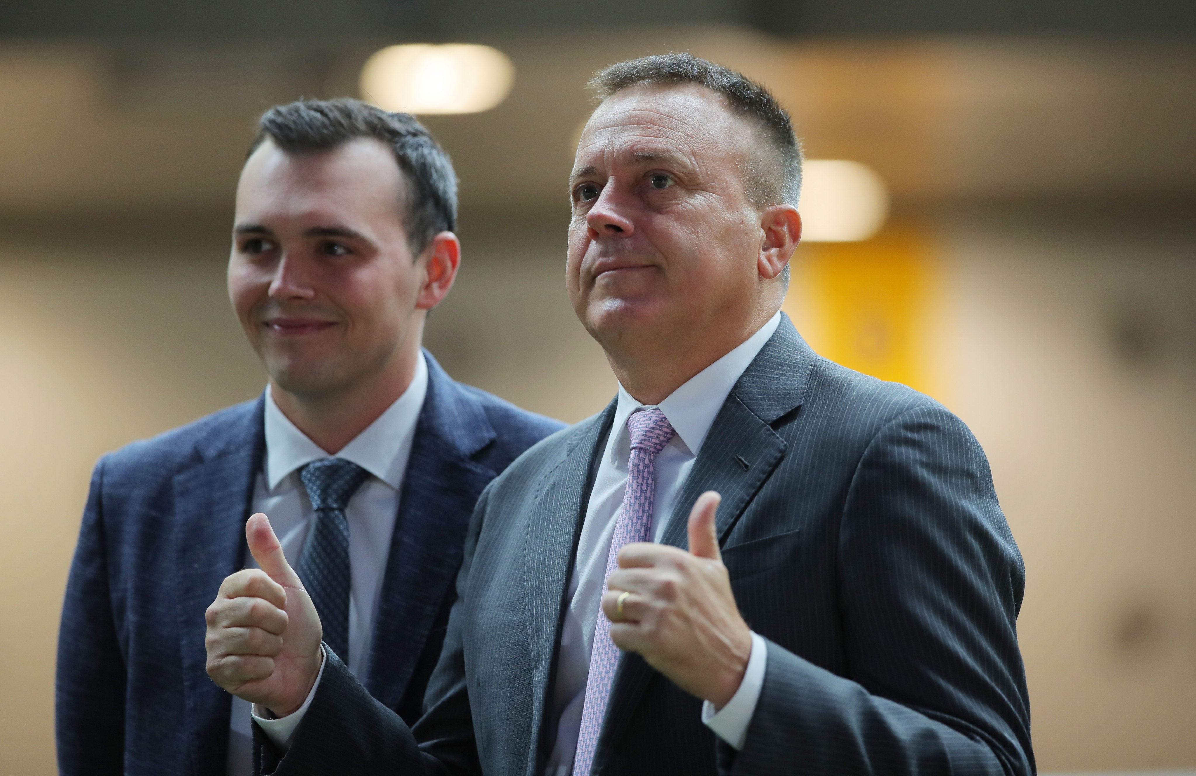 Caspar Fownes (right) and son Ronan celebrate the stable’s latest treble at the Valley. Photos: Kenneth Chan