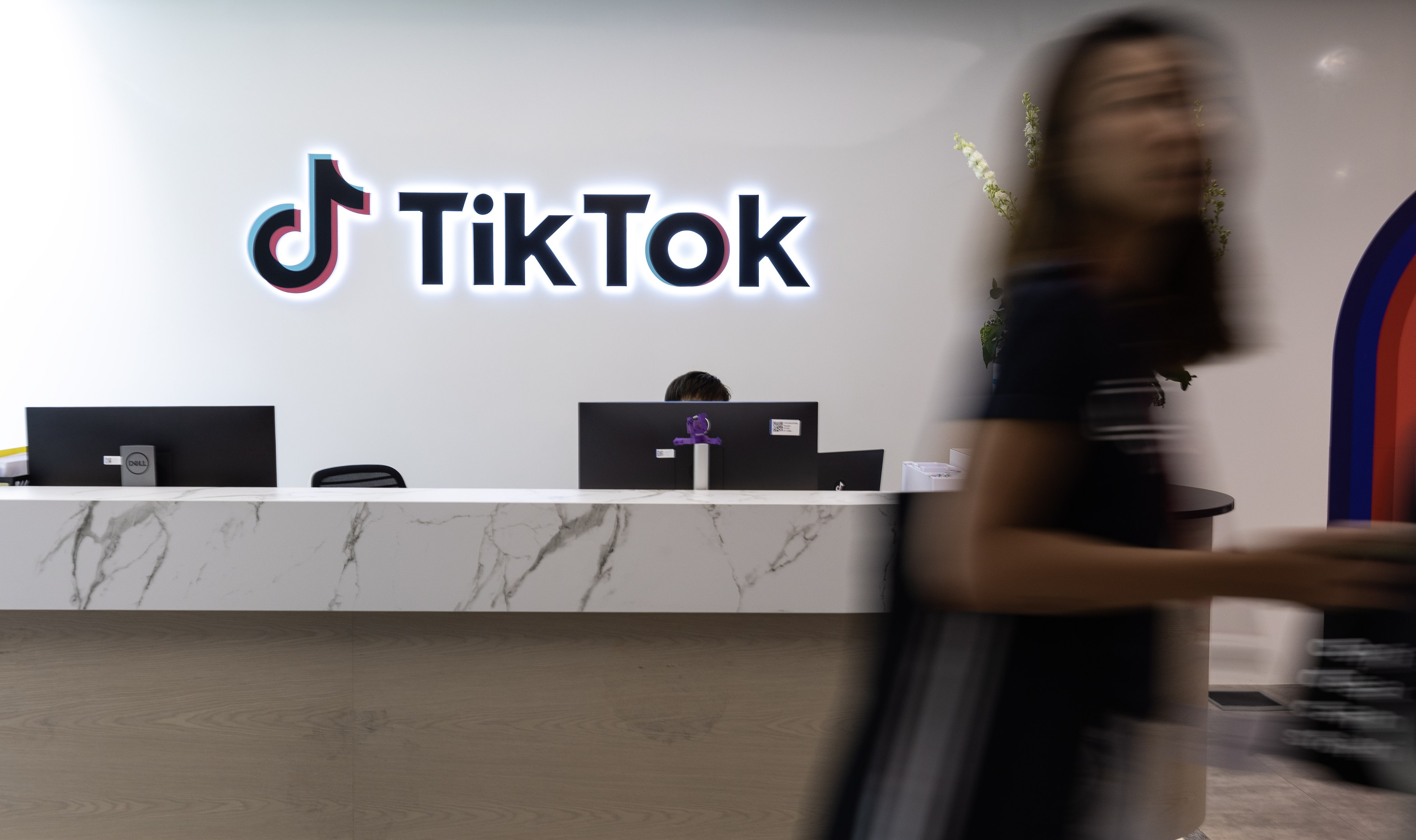 A staff member walks past the reception counter at the TikTok office in Singapore in August 2023. Photo: EPA-EFE