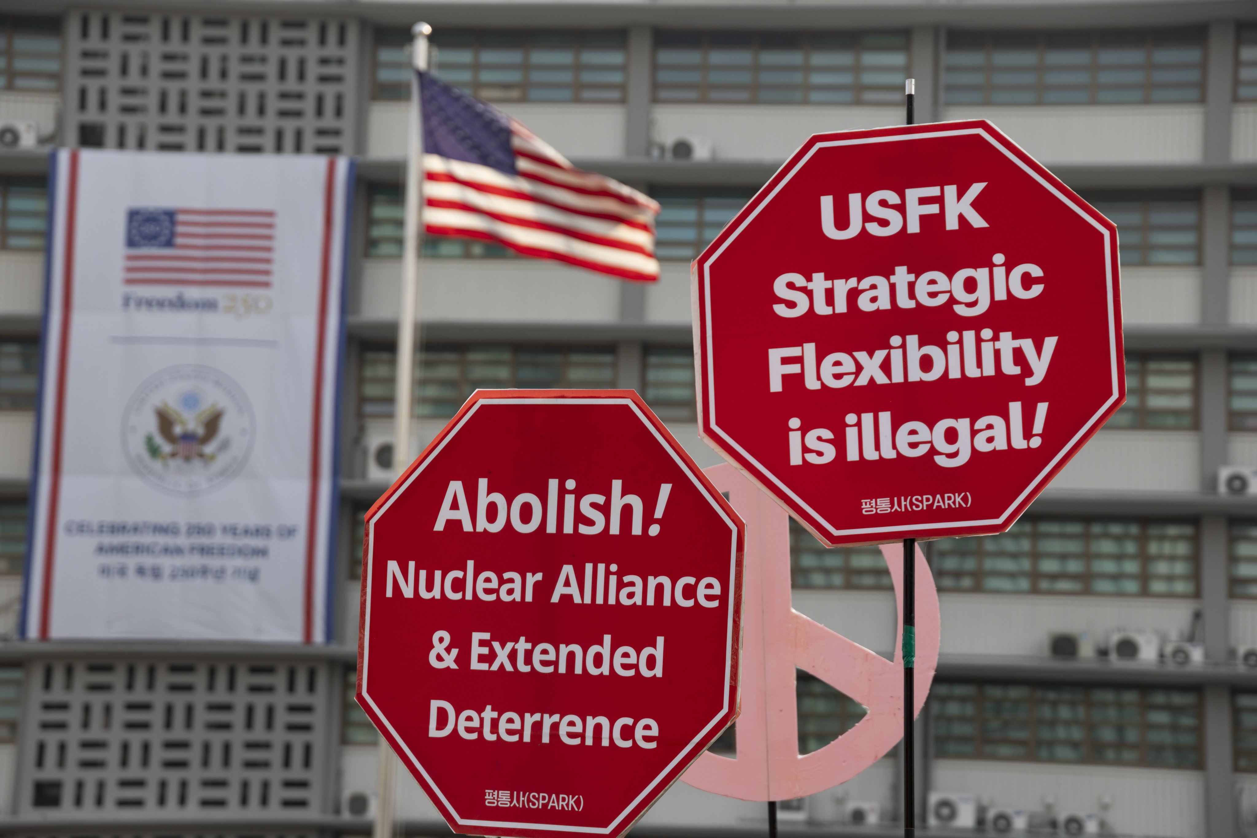 Members of Korean Peace Solidarity for Sovereignty and Reunification shout slogans and hold banners during a rally against US and South Korean military exercises outside the US embassy in Seoul on Monday. Photo: EPA