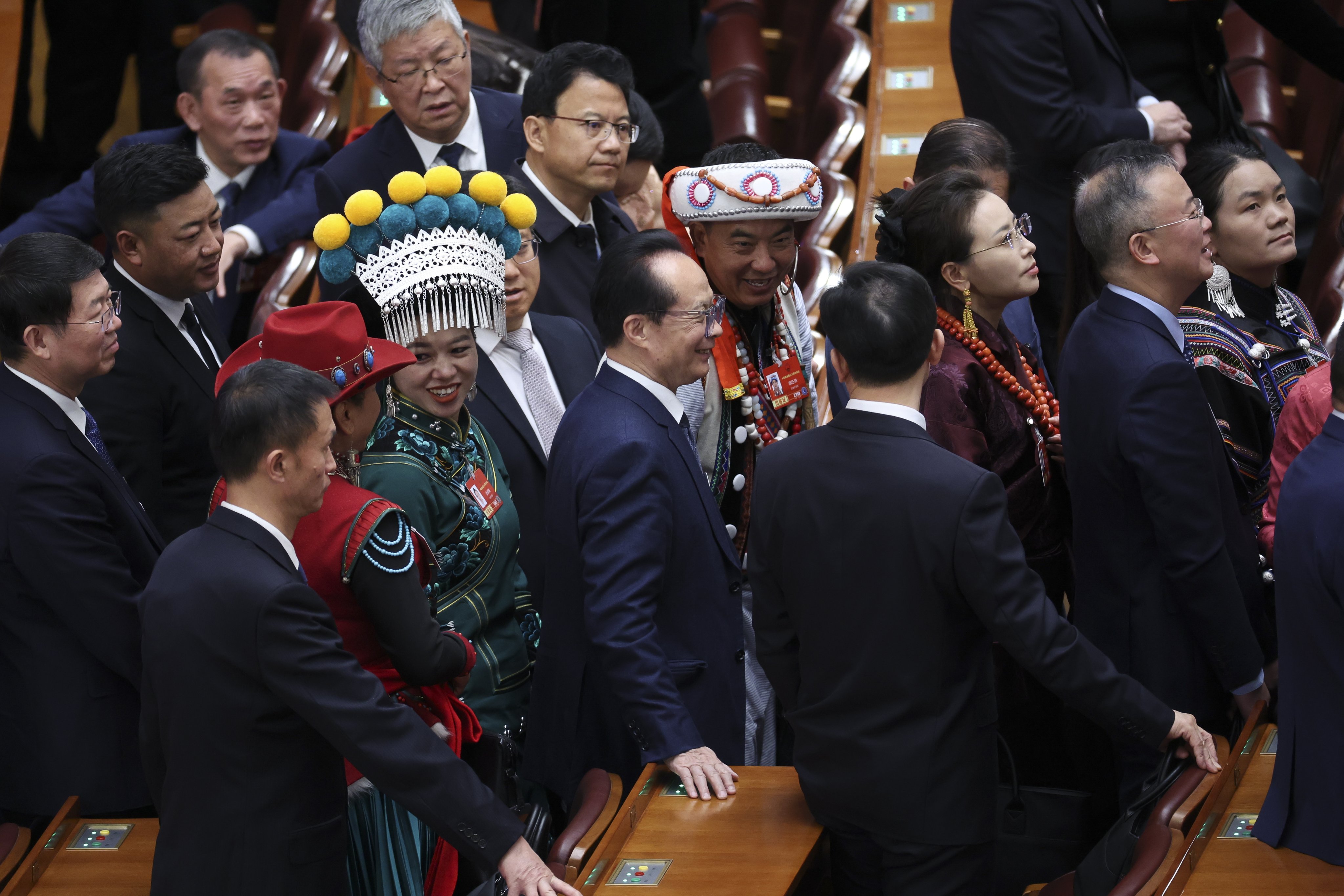 Delegates exit the venue after the second plenary meeting of the Fourth Session of the 14th National People’s Congress (NPC) of China in Beijing. Photo: EPA
