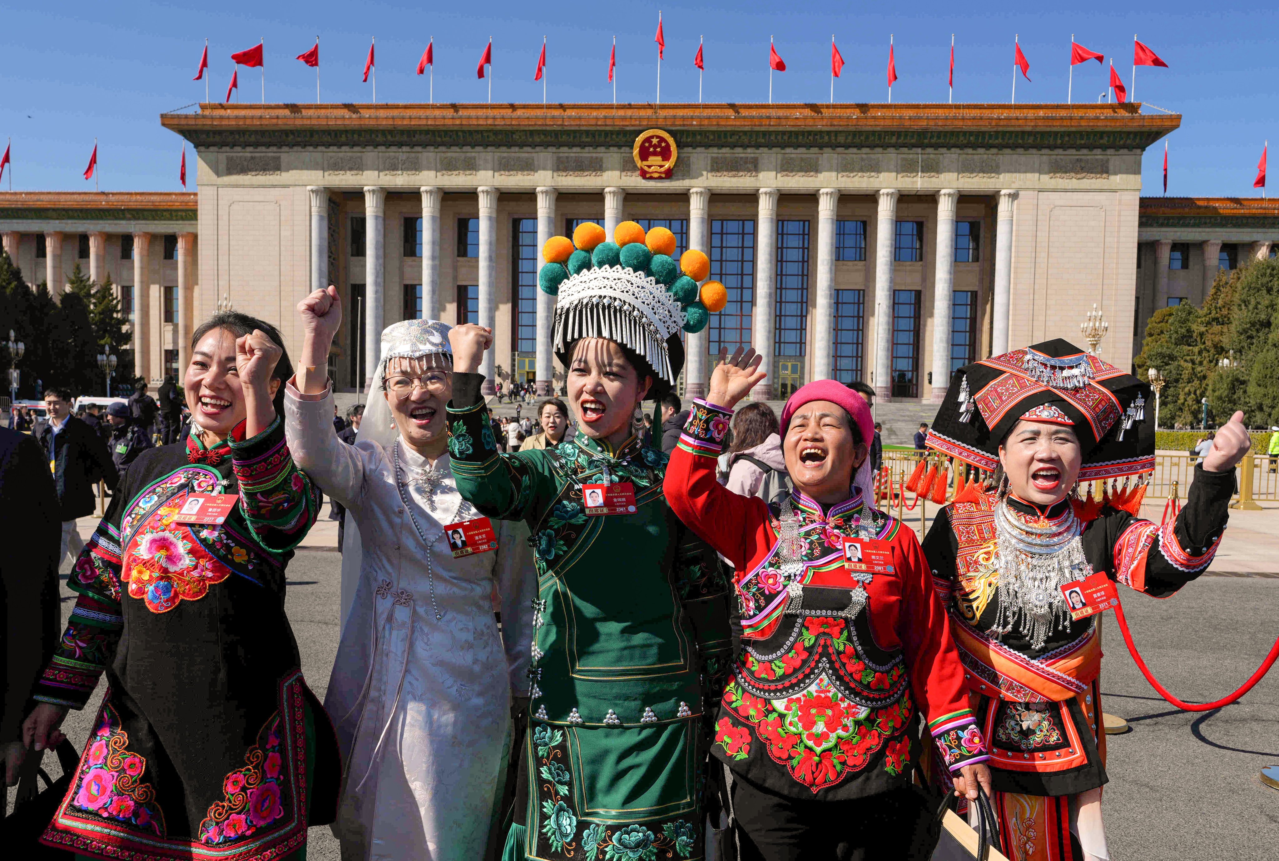 Ethnic minority delegates leave a plenary session of the National People’s Congress (NPC) held at the Great Hall of the People in Beijing on Monday. Photo: AP