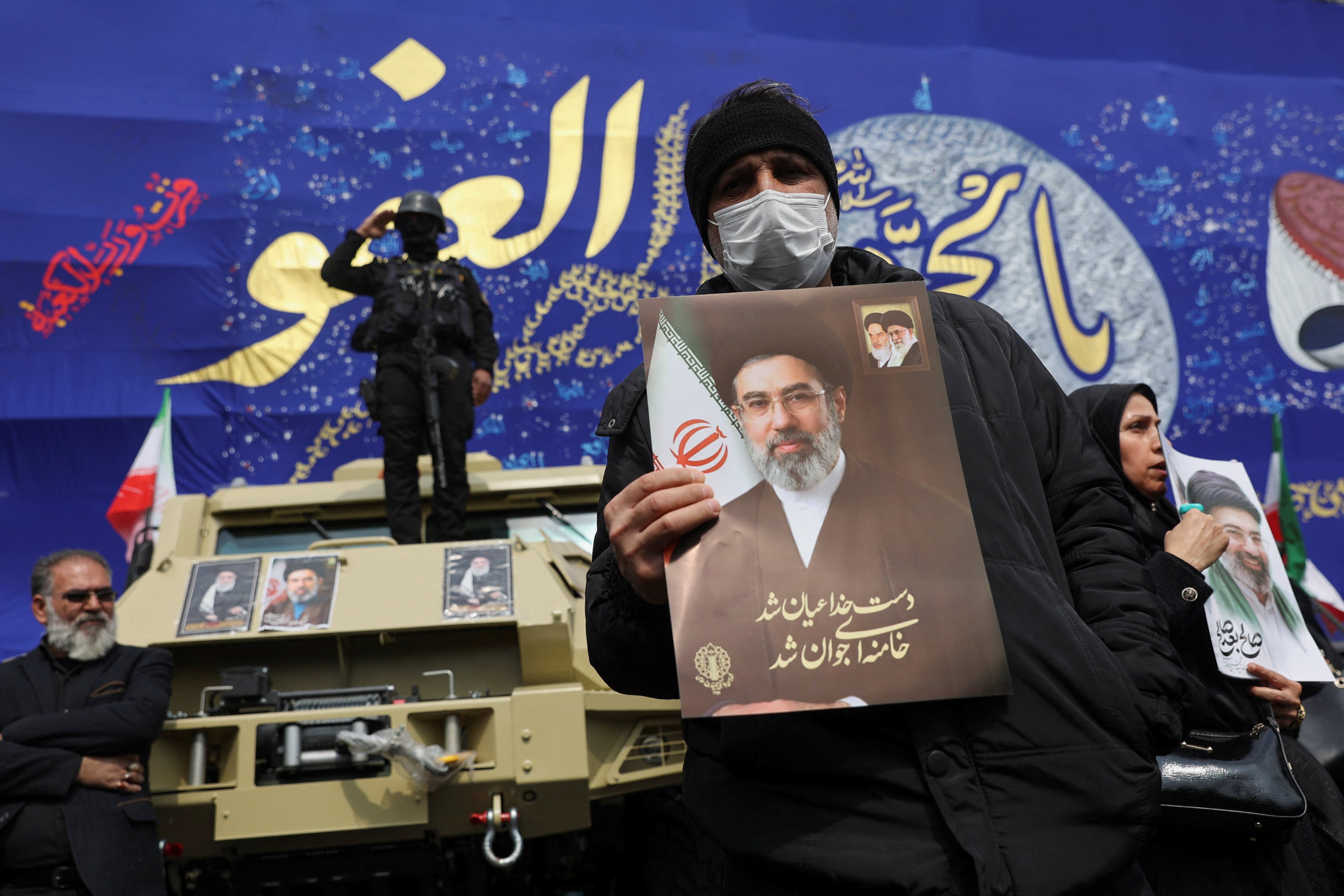 A man holds a picture of Iran’s Supreme Leader Mojtaba Khamenei in Tehran on Wednesday. Photo: WANA via Reuters