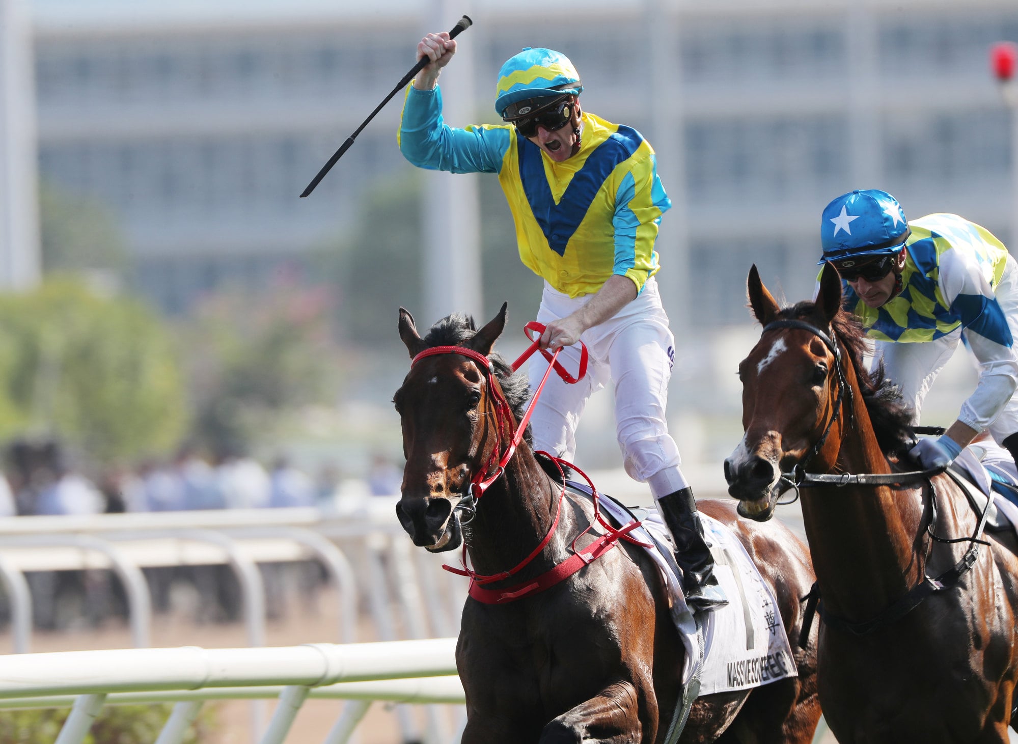 Zac Purton celebrates his Derby victory on Massive Sovereign in 2024.