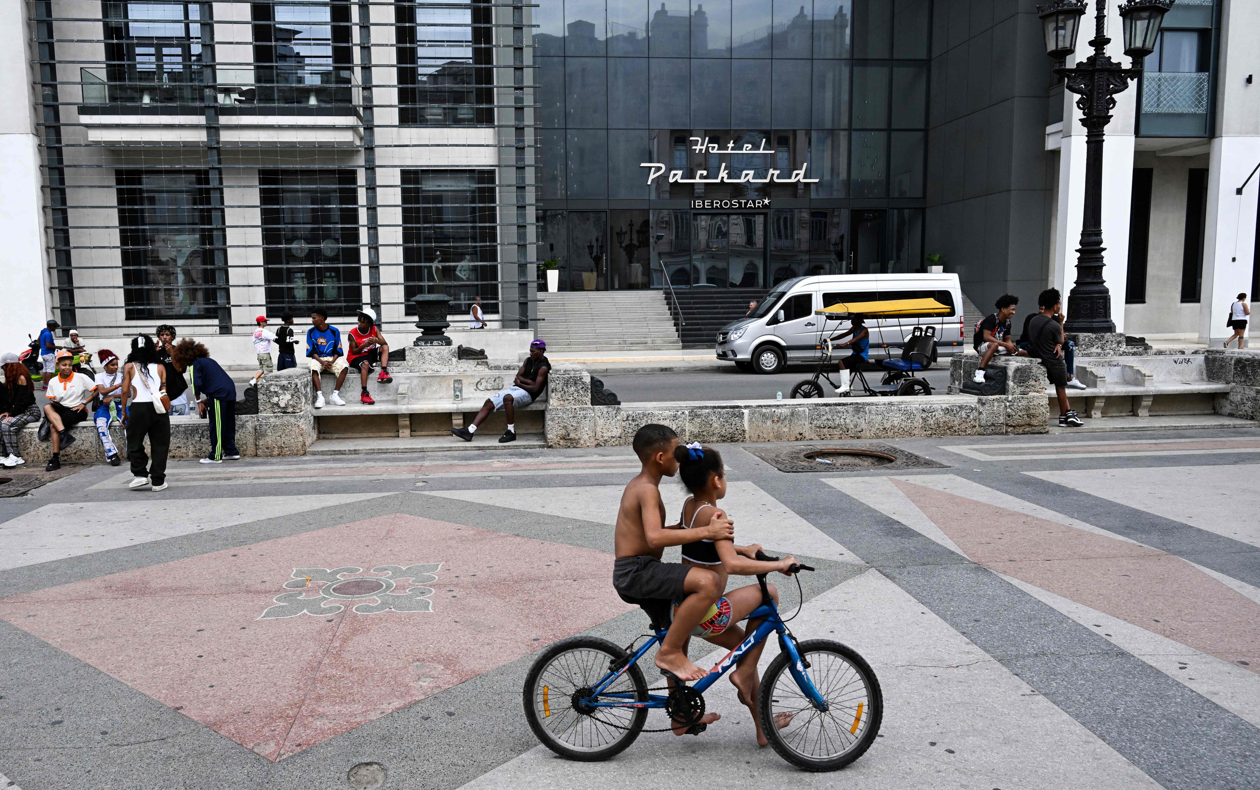 People spend time in the public area in front of a hotel in Havana, Cuba, on Thursday. Photo: AFP