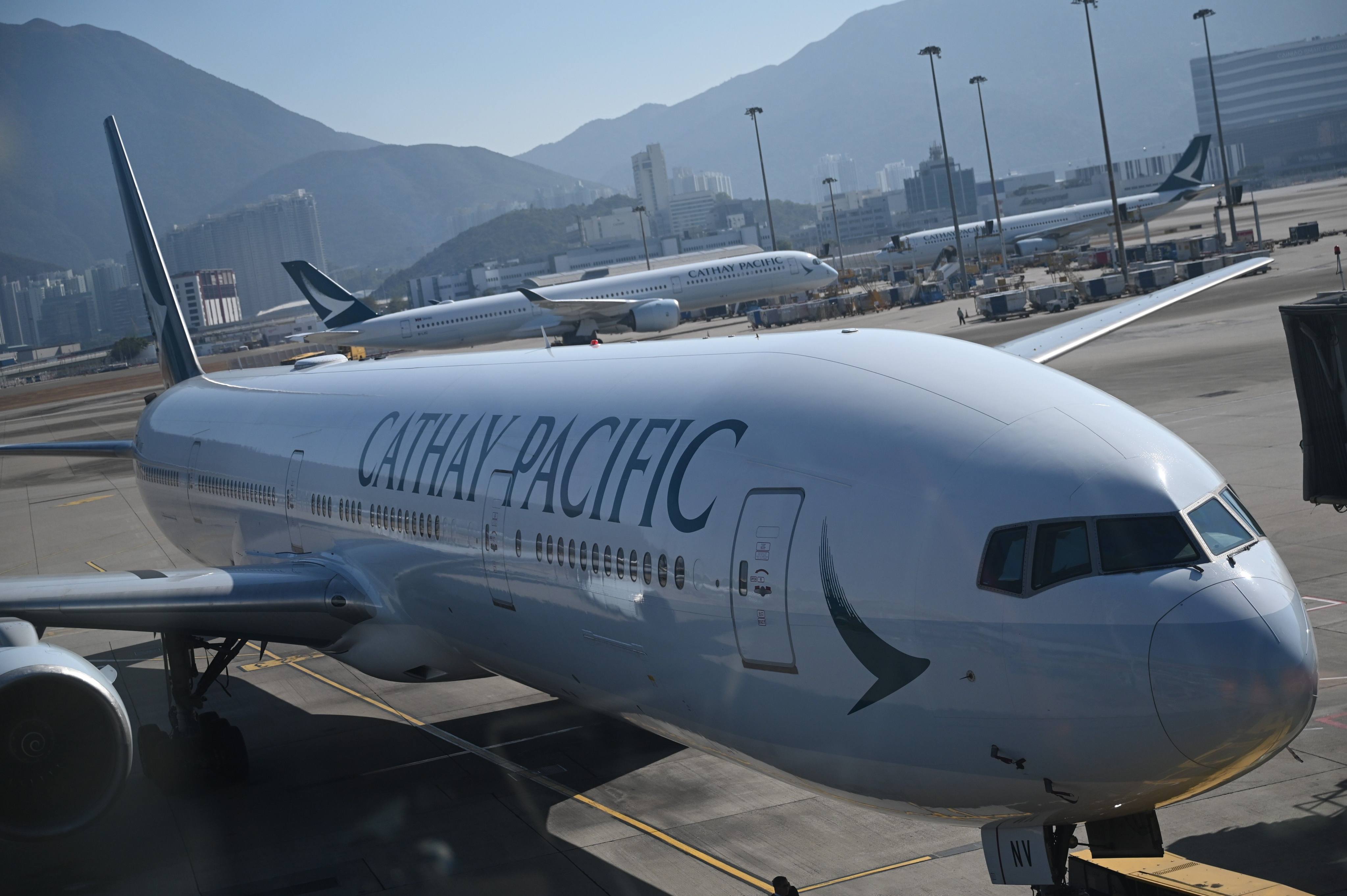 A Cathay Pacific plane stands at a gate at Hong Kong International Airport on January 25. Photo: dpa